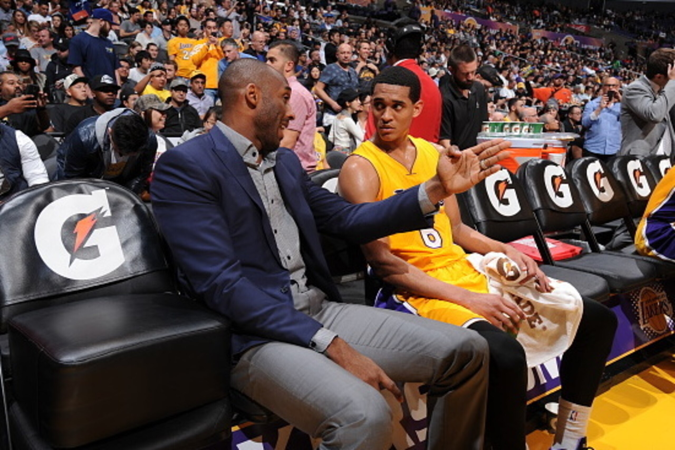 LOS ANGELES, CA - MARCH 10: Kobe Bryant #24 and Jordan Clarkson #6 of the Los Angeles Lakers speak during a game against the Detroit Pistons at STAPLES Center on March 10, 2015 in Los Angeles, California. NOTE TO USER: User expressly acknowledges and agre