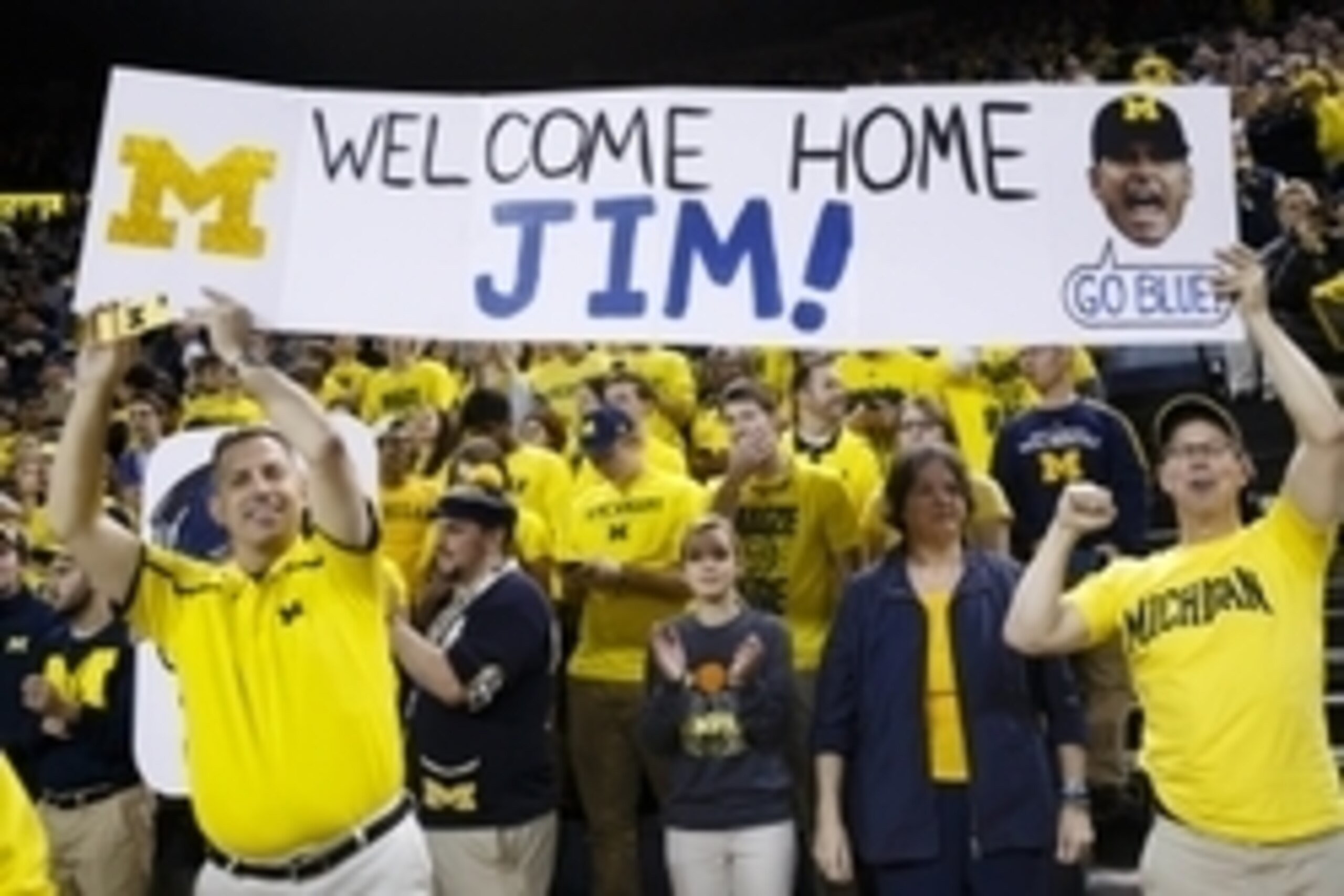 Dec 30, 2014; Ann Arbor, MI, USA; Fans hold up a sign for new Michigan Wolverines head football coach Jim Harbaugh during halftime of the basketball game against the Illinois Fighting Illini at Crisler Center. Mandatory Credit: Rick Osentoski-USA TODAY Sp