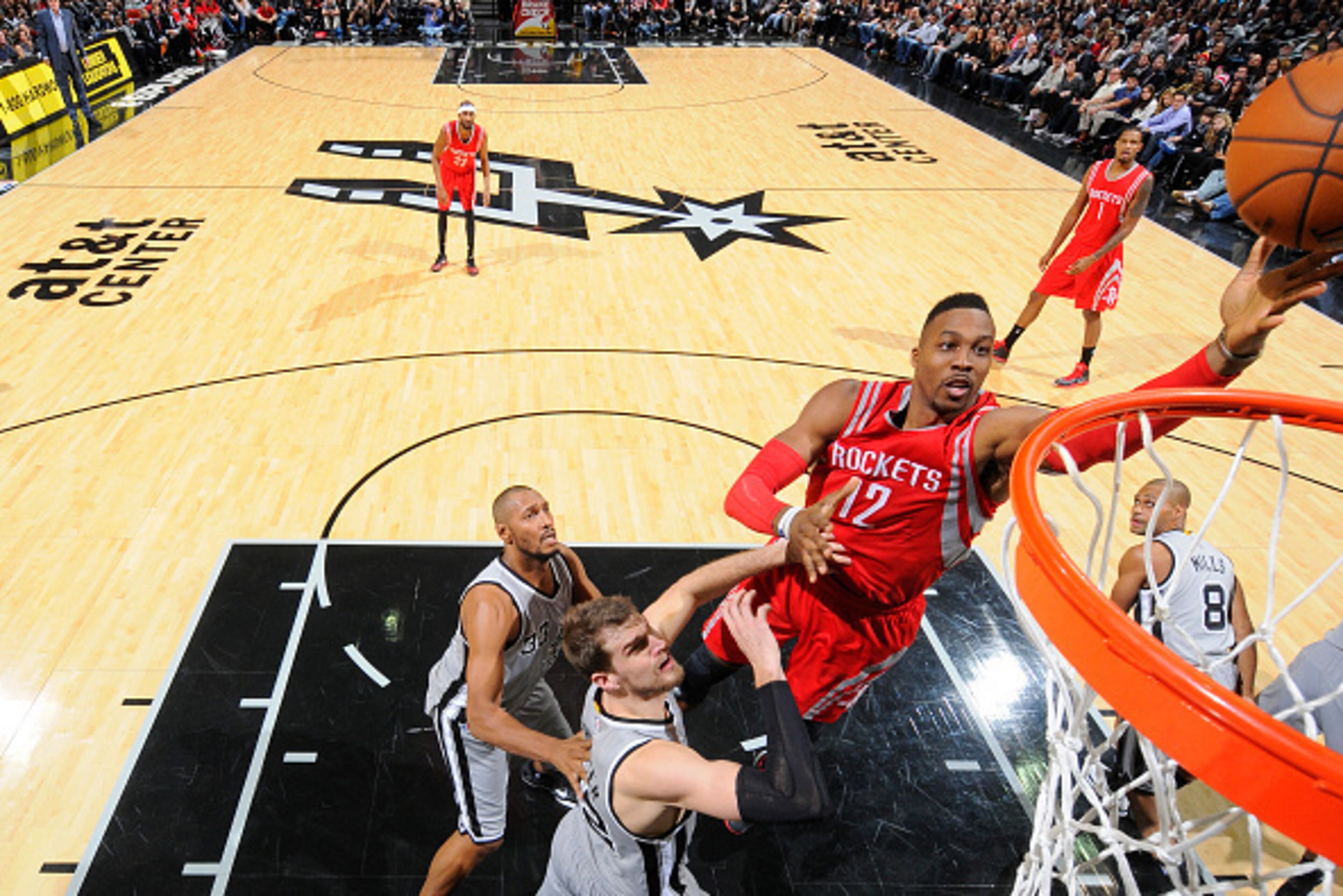 SAN ANTONIO, TX - DECEMBER 28:  Dwight Howard #12 of the Houston Rockets shoots the ball against the San Antonio Spurs during the game on December 28, 2014 at the AT&T Center in San Antonio, Texas. NOTE TO USER: User expressly acknowledges and agrees that