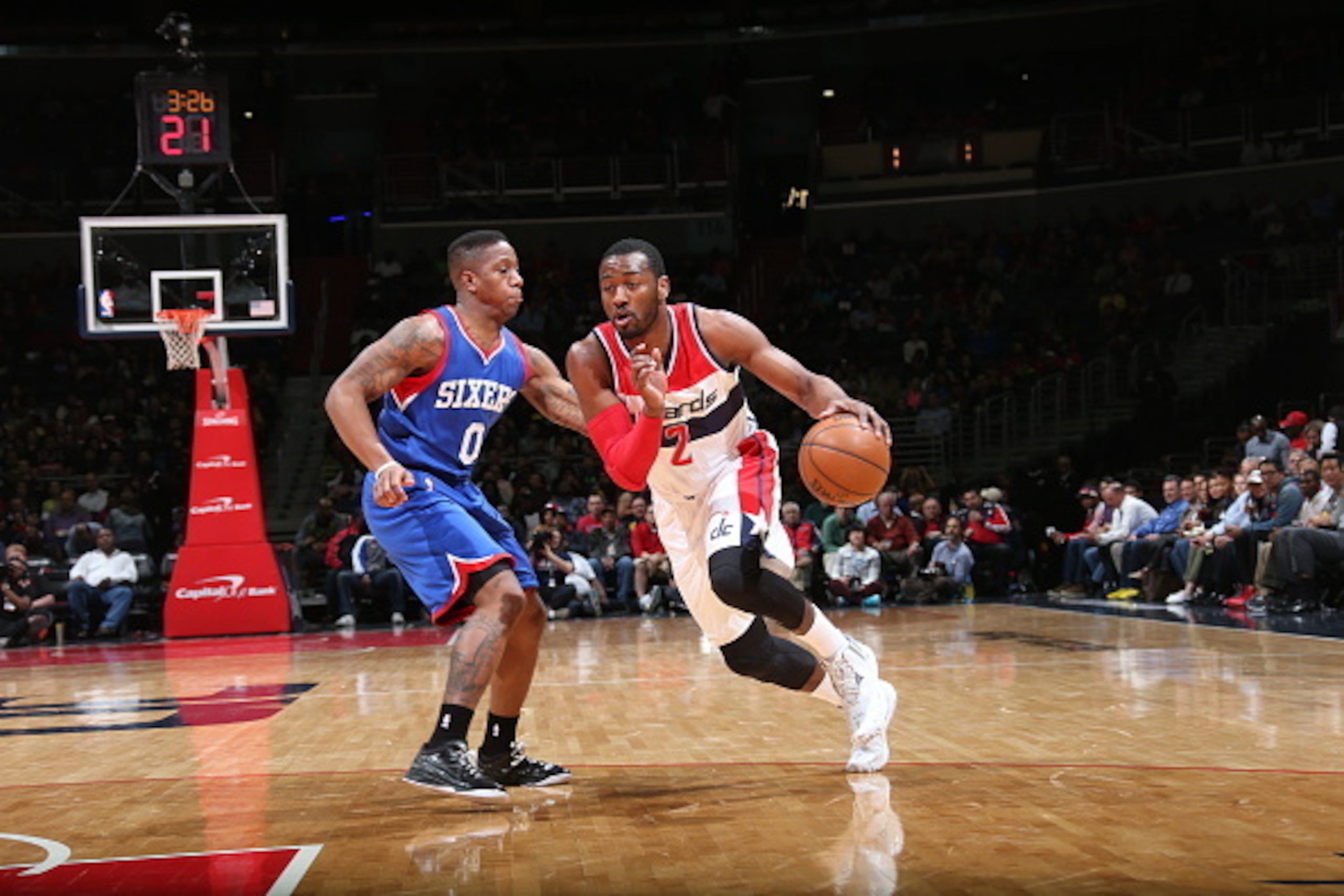 WASHINGTON, DC - APRIL 1: John Wall #2 of the Washington Wizards drives to the basket against Isaiah Canaan #0 of the Philadelphia 76ers on April 1, 2015 at the Verizon Center in Washington, DC. NOTE TO USER: User expressly acknowledges and agrees that, WASHINGTON, DC - APRIL 1: John Wall #2 of the Washington Wizards drives to the basket against Isaiah Canaan #0 of the Philadelphia 76ers on April 1, 2015 at the Verizon Center in Washington, DC. NOTE TO USER: User expressly acknowledges and agrees that,