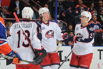 EDMONTON, AB - MARCH 18: Ryan Johansen #19, Ryan Murray #27, and Cam Atkinson #13 of the Columbus Blue Jackets celebrate after a goal during the game against the Edmonton Oilers on March 18, 2015 at Rexall Place in Edmonton, Alberta, Canada. (Photo by And