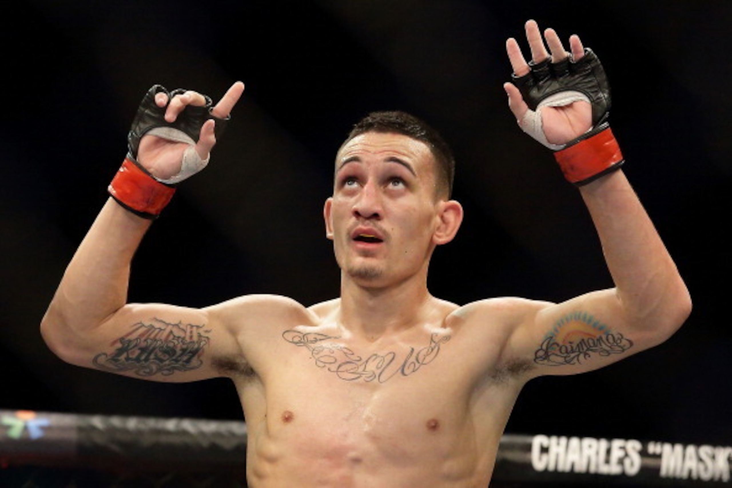 SINGAPORE - JANUARY 04: Max Holloway reacts after defeating Will Chope during their UFC Fight Night Singapore featherweight bout at Marina Bay Sands on January 4, 2014 in Singapore. (Photo by Suhaimi Abdullah/Getty Images) SINGAPORE - JANUARY 04: Max Holloway reacts after defeating Will Chope during their UFC Fight Night Singapore featherweight bout at Marina Bay Sands on January 4, 2014 in Singapore. (Photo by Suhaimi Abdullah/Getty Images)