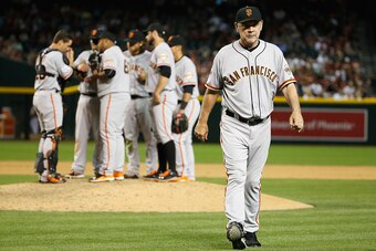 PHOENIX, AZ - APRIL 06:  Manager Bruce Bochy #15 of the San Francisco Giants during the Opening Day MLB game against the Arizona Diamondbacks at Chase Field on April 6, 2015 in Phoenix, Arizona. The Giants defeated the Diamondbacks 5-4.  (Photo by Christi