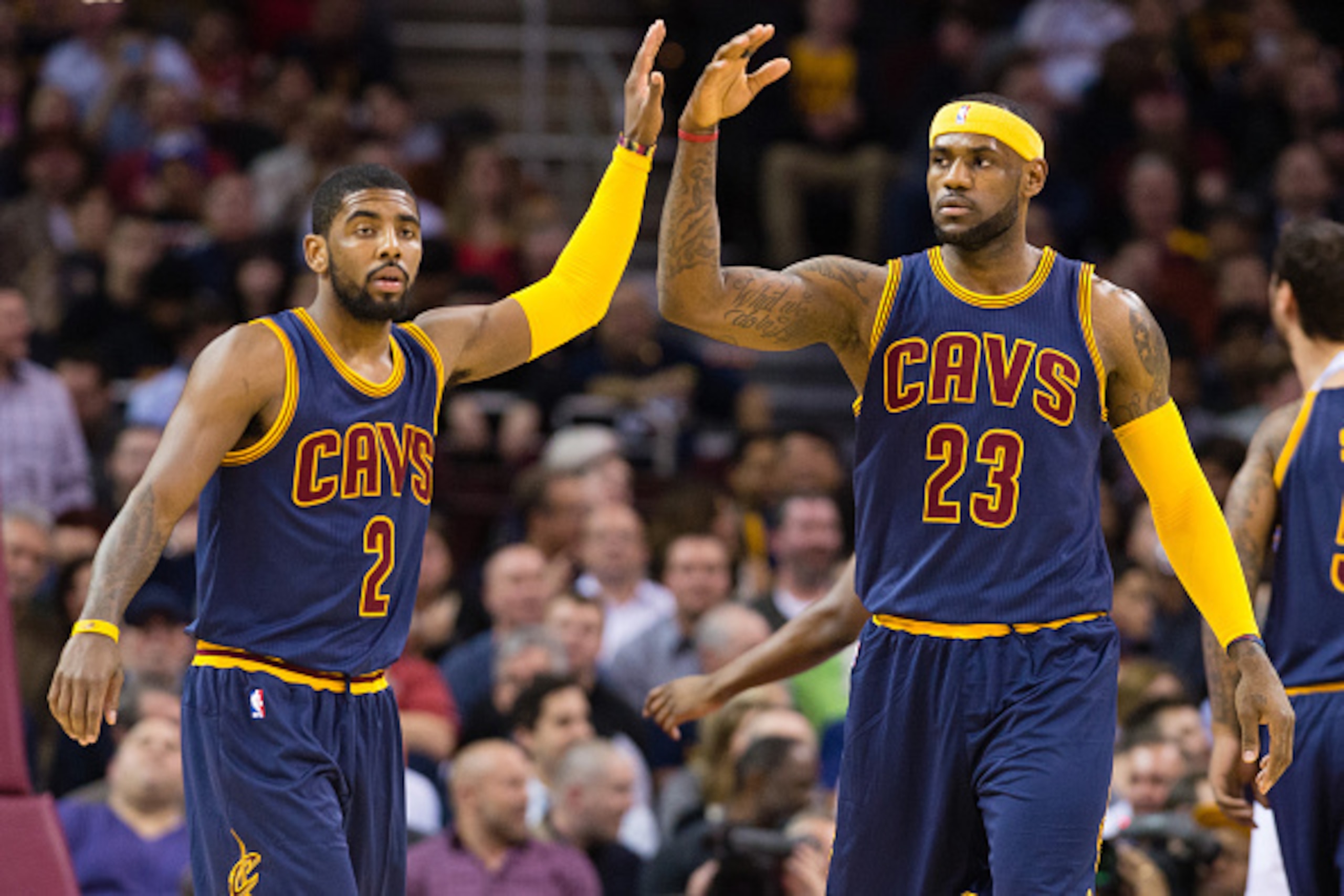 CLEVELAND, OH - FEBRUARY 26: Kyrie Irving #2 and LeBron James #23 of the Cleveland Cavaliers celebrate during the first half against the Golden State Warriors at Quicken Loans Arena on February 26, 2015 in Cleveland, Ohio. NOTE TO USER: User expressly ack