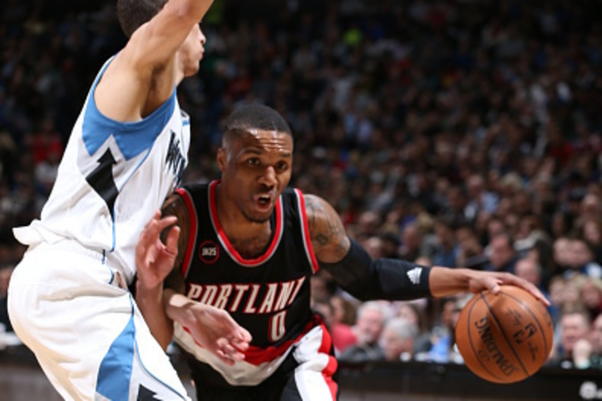 MINNEAPOLIS, MN - MARCH 7: Damian Lillard #0 of the Portland Trail Blazers drives to the basket against the Minnesota Timberwolves during the game on March 7, 2015 at Target Center in Minneapolis, Minnesota. NOTE TO USER: User expressly acknowledges and a