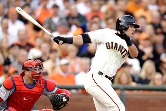 SAN FRANCISCO, CA - OCTOBER 15:  Joe Panik #12 of the San Francisco Giants hits a single in the first inning against the St. Louis Cardinals during Game Four of the National League Championship Series at AT&T Park on October 15, 2014 in San Francisco, Cal