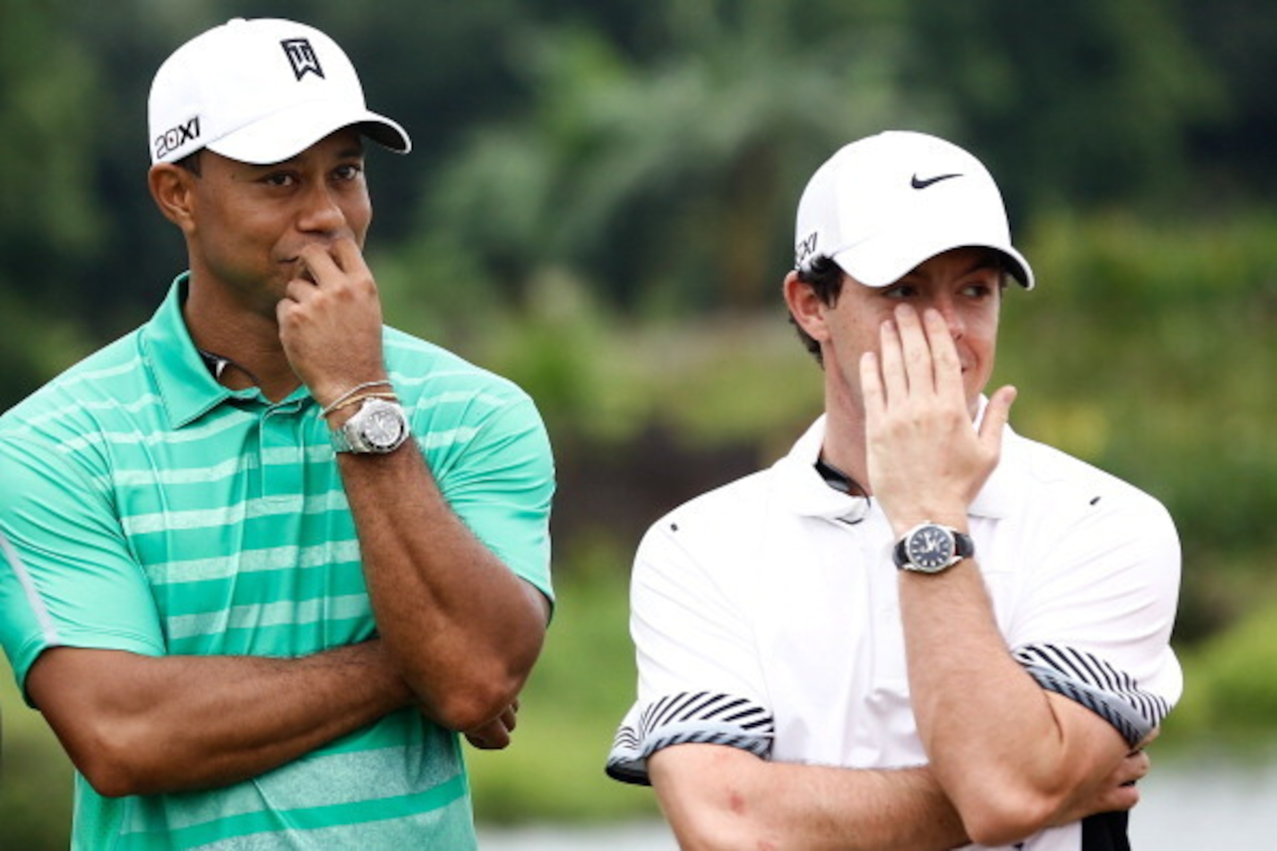 HAIKOU, CHINA - OCTOBER 28: Tiger Woods of the United States with Rory McIlroy of Northern Ireland react at Blackstone Course Mission Hills on October 28, 2013 in Haikou, China.  (Photo by Lintao Zhang/Getty Images)