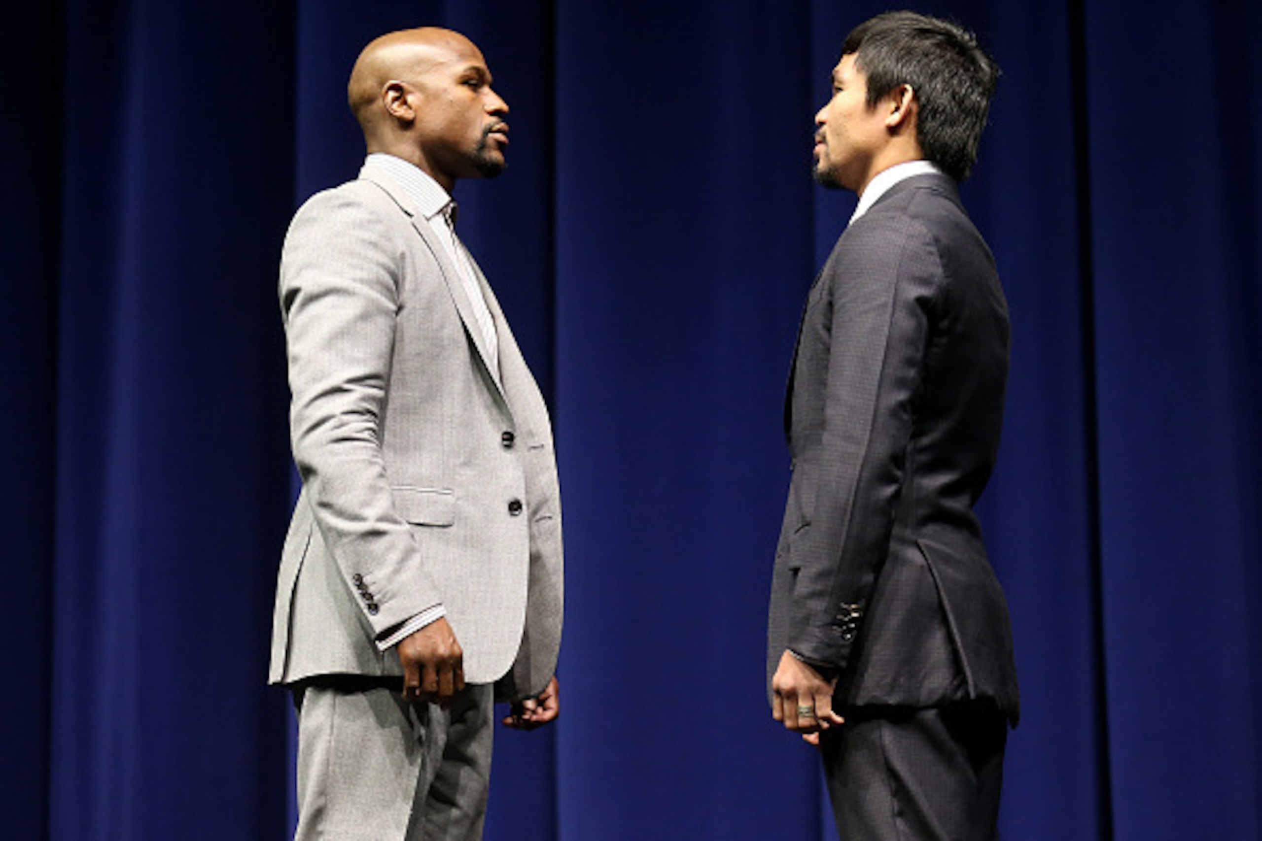 LOS ANGELES, CA - MARCH 11:  Floyd Mayweather (L) and Manny Pacquiao face off at the start of their Press Conference promoting their upcoming fight on March 11, 2015 in Los Angeles, California.  (Photo by Stephen Dunn/Getty Images)