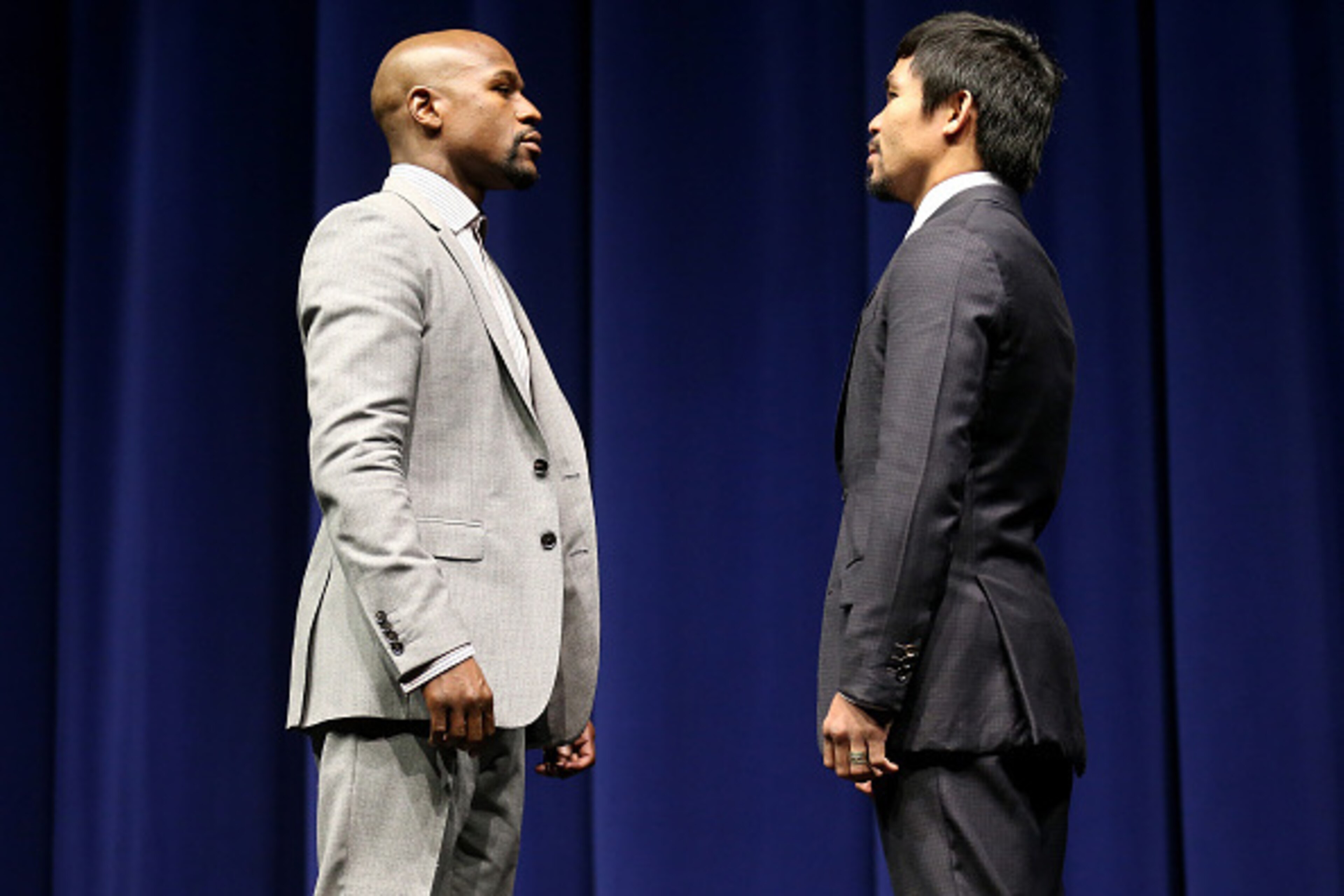 LOS ANGELES, CA - MARCH 11: Floyd Mayweather (L) and Manny Pacquiao face off at the start of their Press Conference promoting their upcoming fight on March 11, 2015 in Los Angeles, California. (Photo by Stephen Dunn/Getty Images) LOS ANGELES, CA - MARCH 11: Floyd Mayweather (L) and Manny Pacquiao face off at the start of their Press Conference promoting their upcoming fight on March 11, 2015 in Los Angeles, California. (Photo by Stephen Dunn/Getty Images)