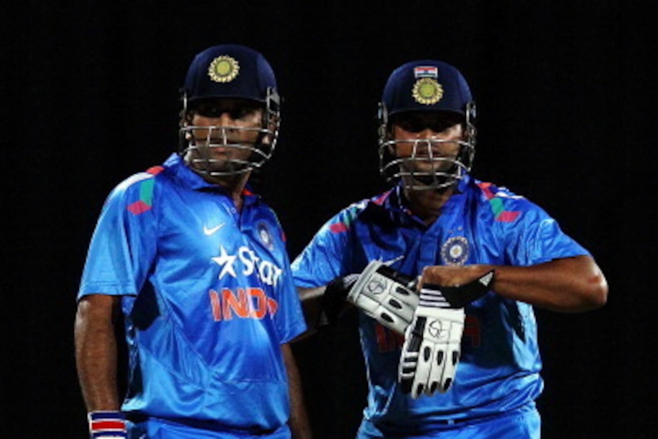 HAMILTON, NEW ZEALAND - JANUARY 22: MS Dhoni (L) and Suresh Raina (R) of India look on during the One Day International match between New Zealand and India at Seddon Park on January 22, 2014 in Hamilton, New Zealand.  (Photo by Anthony Au-Yeung/Getty Imag