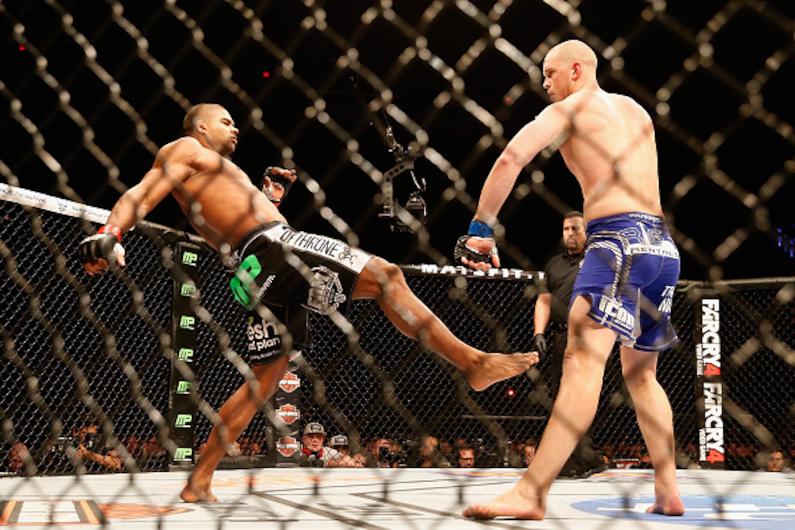 PHOENIX, AZ - DECEMBER 13:  Alistair Overeem (L) kicks Stefan Struve in their heavyweight bout during the UFC Fight Night event at the at U.S. Airways Center on December 13, 2014 in Phoenix, Arizona.  (Photo by Christian Petersen/Getty Images)
