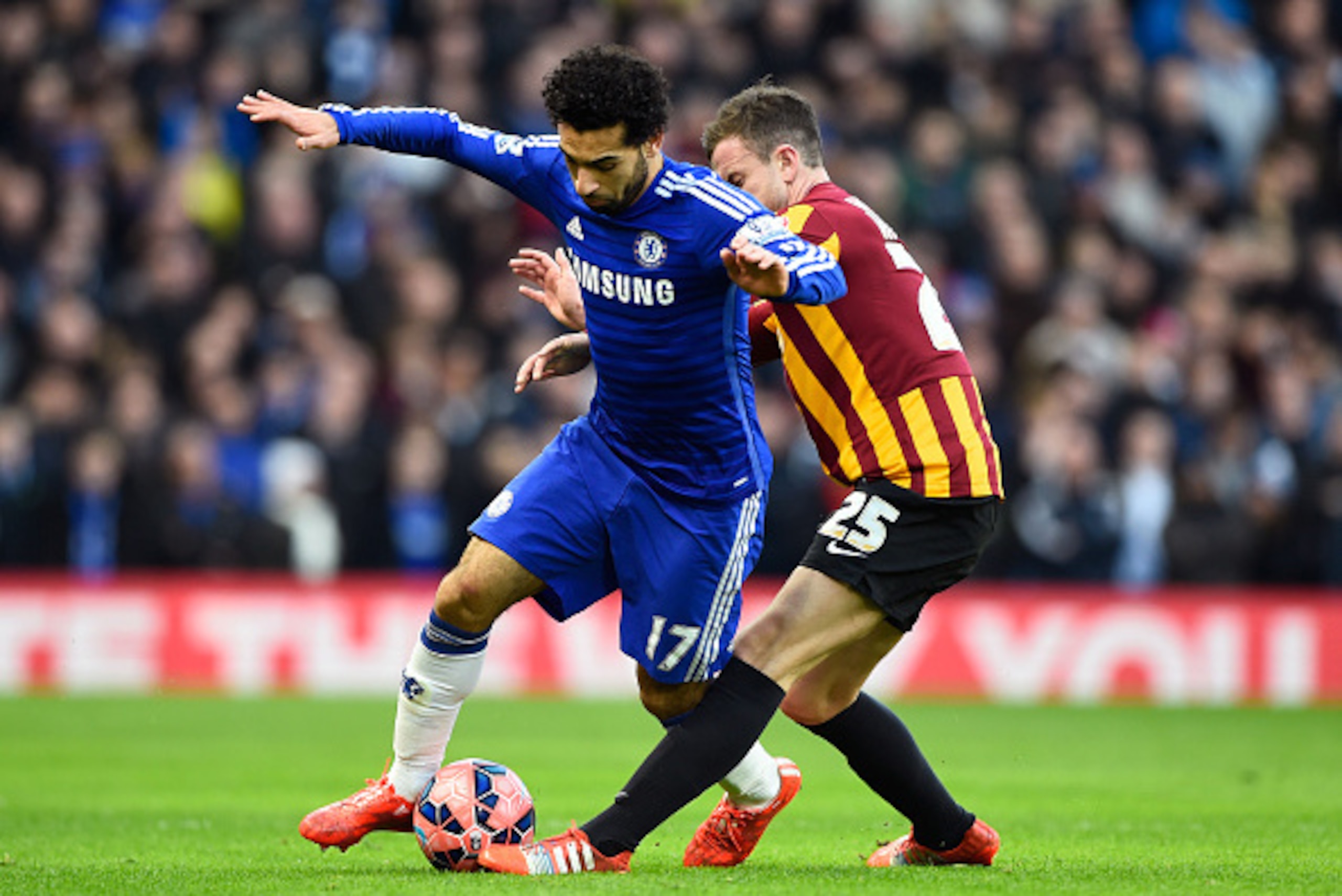 LONDON, ENGLAND - JANUARY 24:  Mohamed Salah of Chelsea is tackled by Andrew Halliday of Bradford City during the FA Cup Fourth Round match between Chelsea and Bradford City at Stamford Bridge on January 24, 2015 in London, England.  (Photo by Mike Hewitt