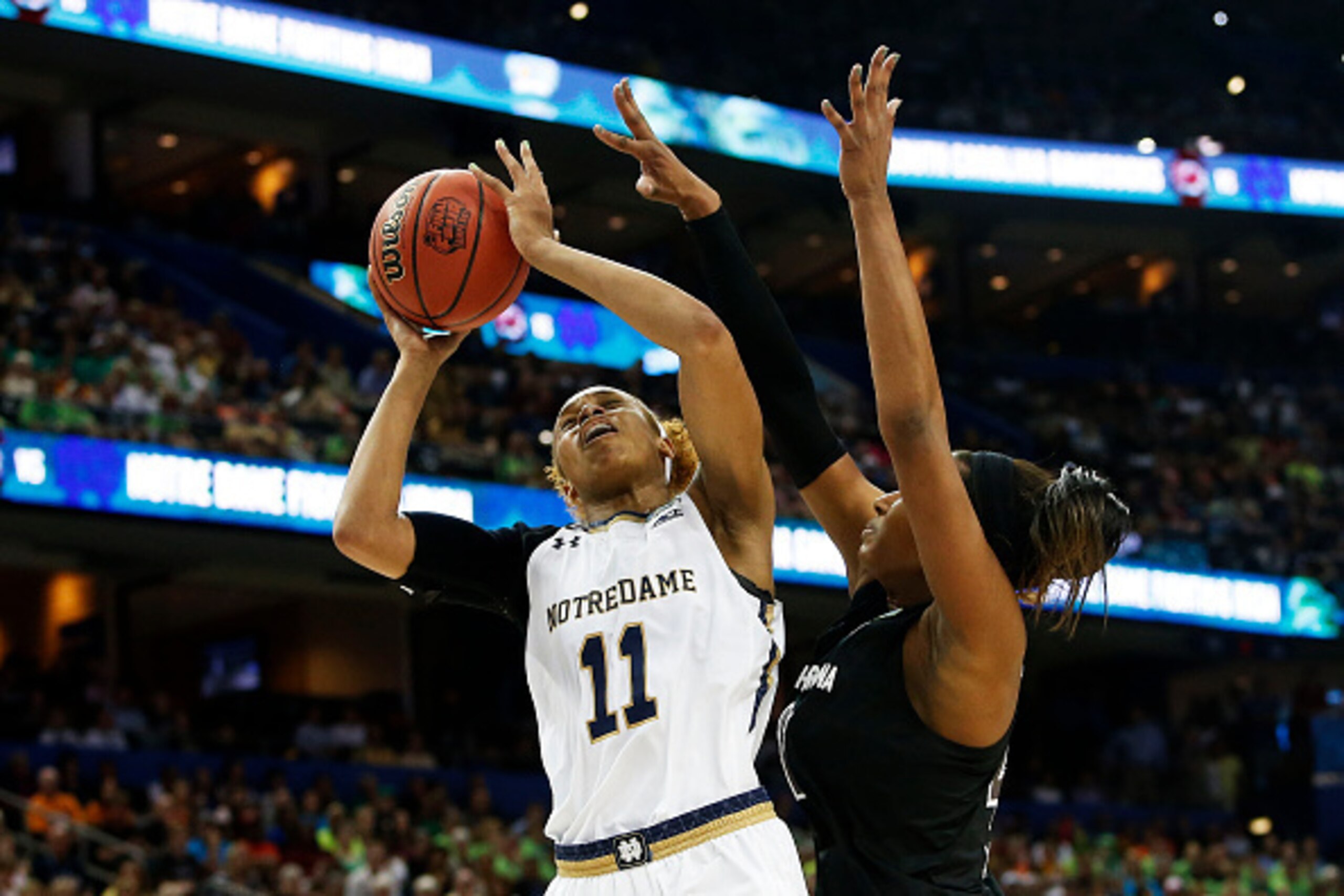 TAMPA, FL - APRIL 05:  Brianna Turner #11 of the Notre Dame Fighting Irish shoots against Alaina Coates #41 of the South Carolina Gamecocks in the first half during the NCAA Women's Final Four Semifinal at Amalie Arena on April 5, 2015 in Tampa, Florida. 