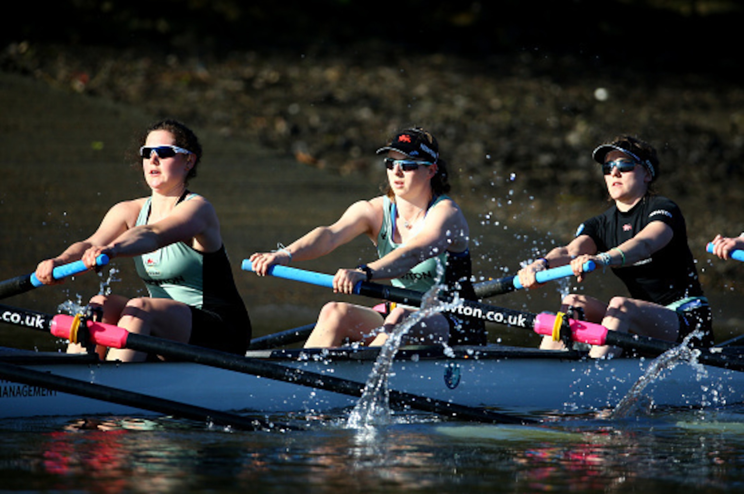 LONDON, ENGLAND - APRIL 07:  (L-R)  Melissa Wilson, Claire Watkins and Caroline Reid of the Cambridge Women's crew in action during a training outting ahead of the Newton Women's University Boat Race on The River Thames on April 7, 2015 in London, England