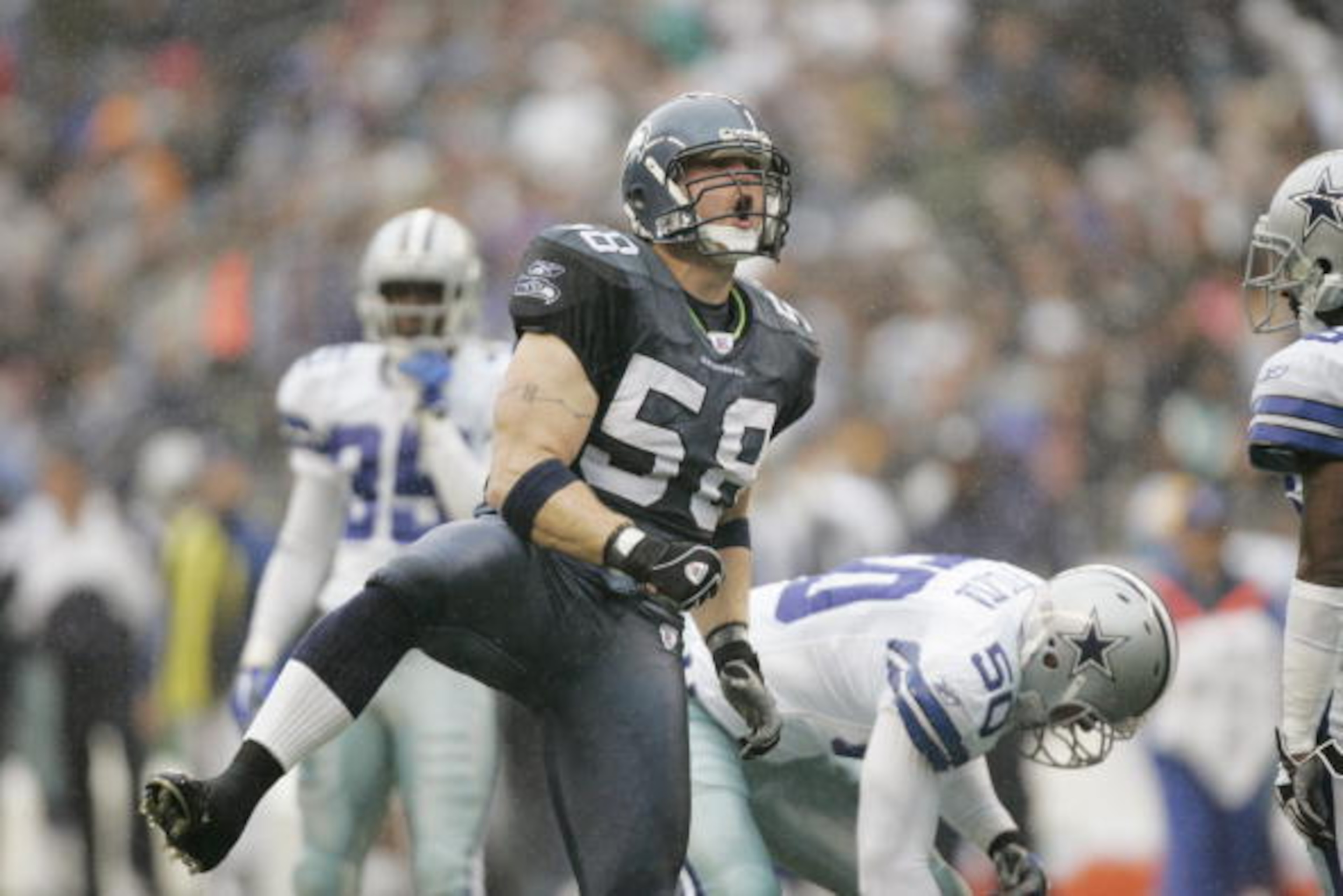 SEATTLE - OCTOBER 23: Linebacker Isaiah Kacyvenski #58 of the Seattle Seahawks celebrates a play against the Dallas Cowboys at Qwest Field on October 23, 2005 in Seattle, Washington. The Seahawks defeated the Cowboys 13-10. (Photo by Otto Greule Jr/Get SEATTLE - OCTOBER 23: Linebacker Isaiah Kacyvenski #58 of the Seattle Seahawks celebrates a play against the Dallas Cowboys at Qwest Field on October 23, 2005 in Seattle, Washington. The Seahawks defeated the Cowboys 13-10. (Photo by Otto Greule Jr/Get