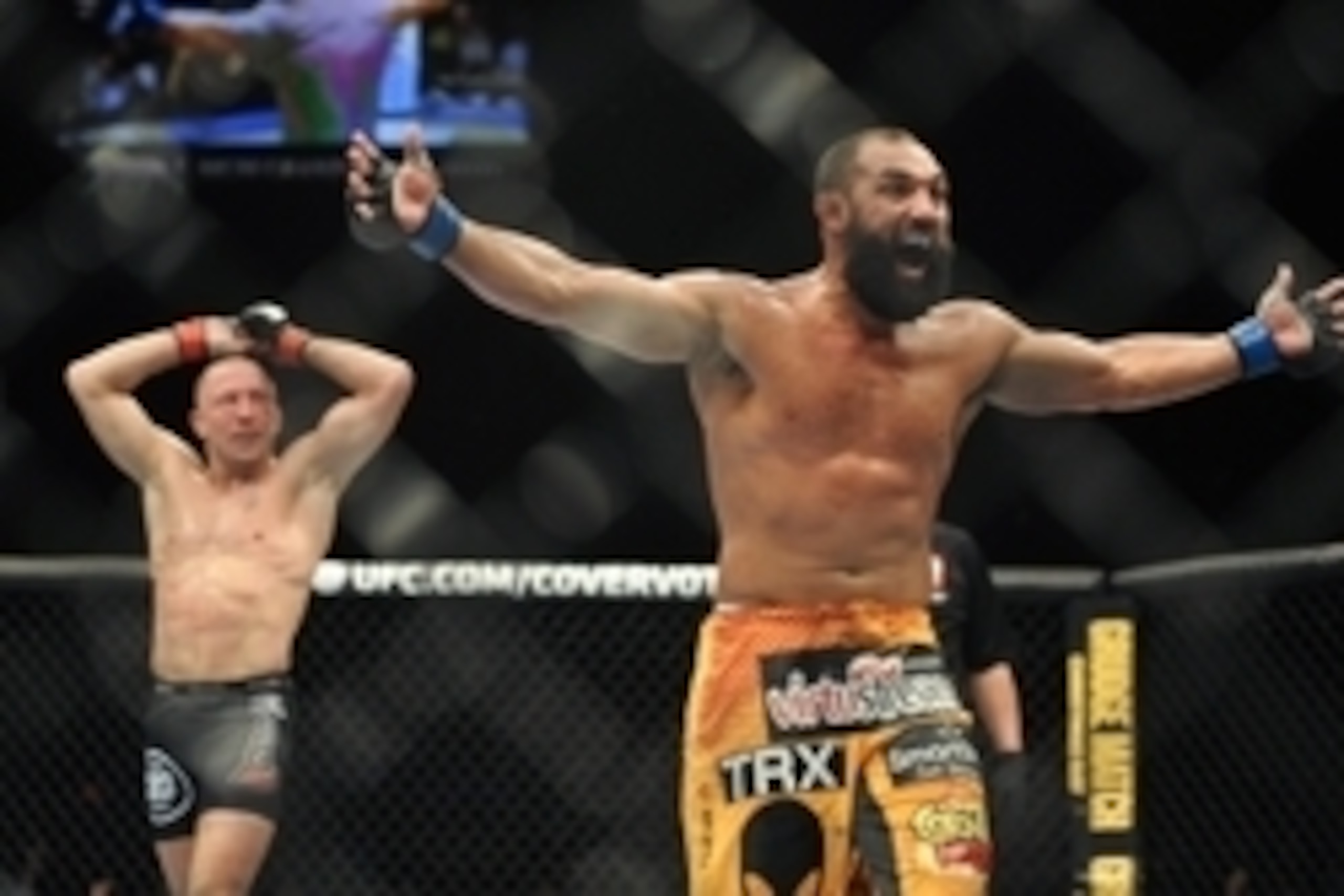 Nov 16, 2013; Las Vegas, NV, USA; Georges St-Pierre (red gloves) and Johny Hendricks (blue gloves) react after their welterweight championship bout during UFC 167 at MGM Grand Garden Arena. Mandatory Credit: Stephen R. Sylvanie-USA TODAY Sports