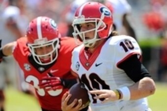 Apr 12, 2014; Athens, GA, USA; Georgia Bulldogs quarterback Faton Bauta (10) runs with the ball during the second half of the Georgia Spring Game at Sanford Stadium. The Red team won 27-24. Mandatory Credit: Dale Zanine-USA TODAY Sports
