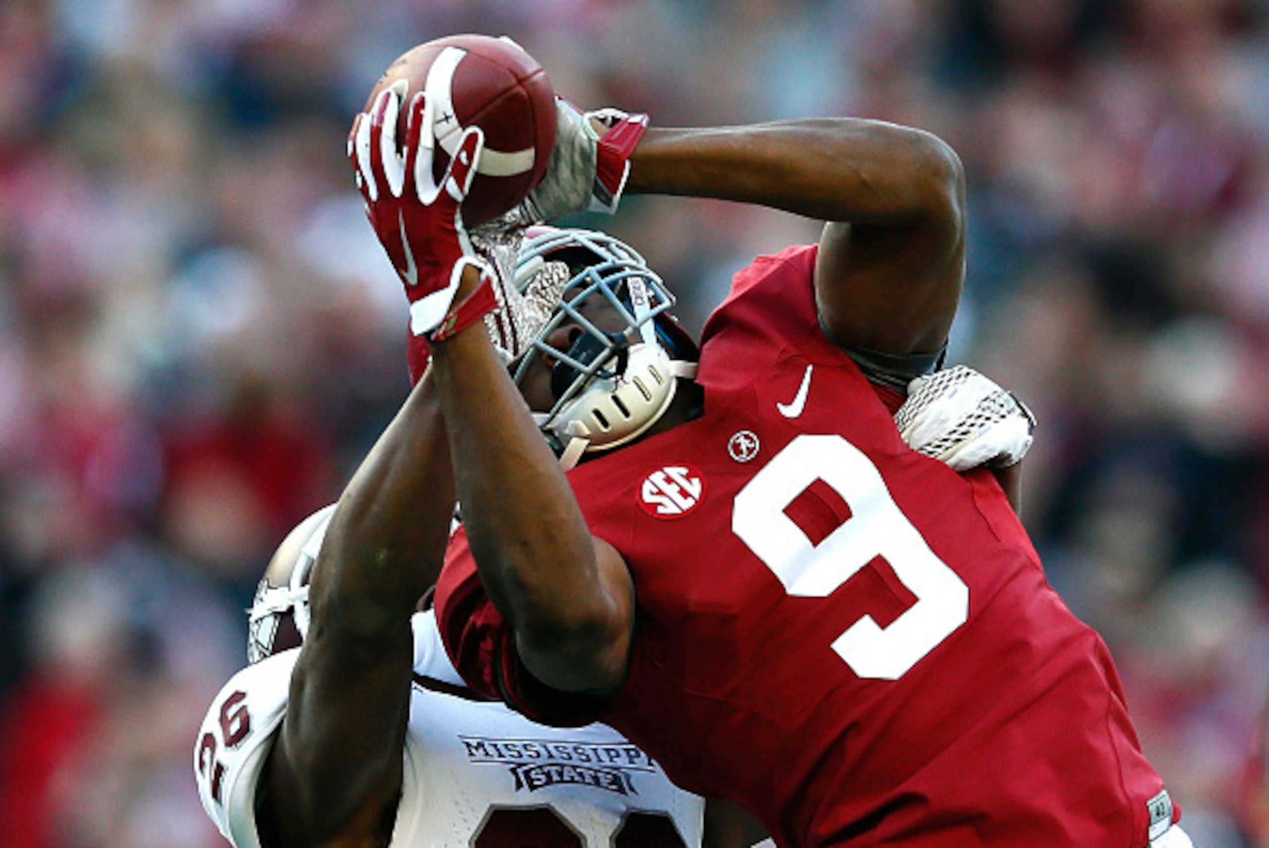 TUSCALOOSA, AL - NOVEMBER 15:  Amari Cooper #9 of the Alabama Crimson Tide pulls in this reception against Kendrick Market #26 of the Mississippi State Bulldogs at Bryant-Denny Stadium on November 15, 2014 in Tuscaloosa, Alabama.  (Photo by Kevin C. Cox/G