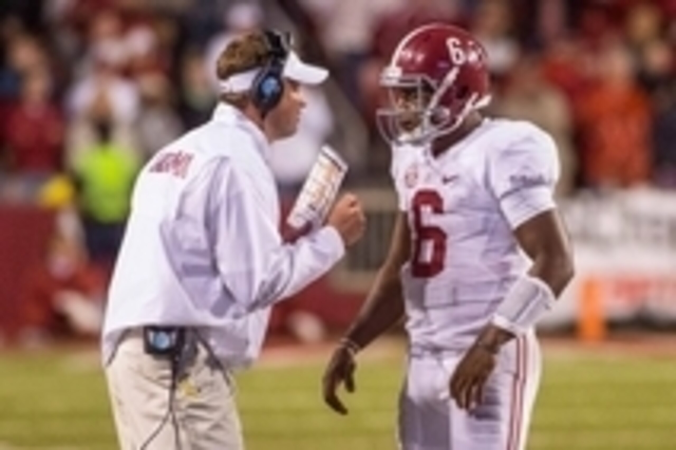 Oct 11, 2014; Fayetteville, AR, USA; Alabama Crimson Tide offensive coordinator Lane Kiffin talks with quarterback Blake Sims (6) during a game against the Arkansas Razorbacks at Donald W. Reynolds Razorback Stadium. Alabama defeated Arkansas 14-13. Manda Oct 11, 2014; Fayetteville, AR, USA; Alabama Crimson Tide offensive coordinator Lane Kiffin talks with quarterback Blake Sims (6) during a game against the Arkansas Razorbacks at Donald W. Reynolds Razorback Stadium. Alabama defeated Arkansas 14-13. Manda