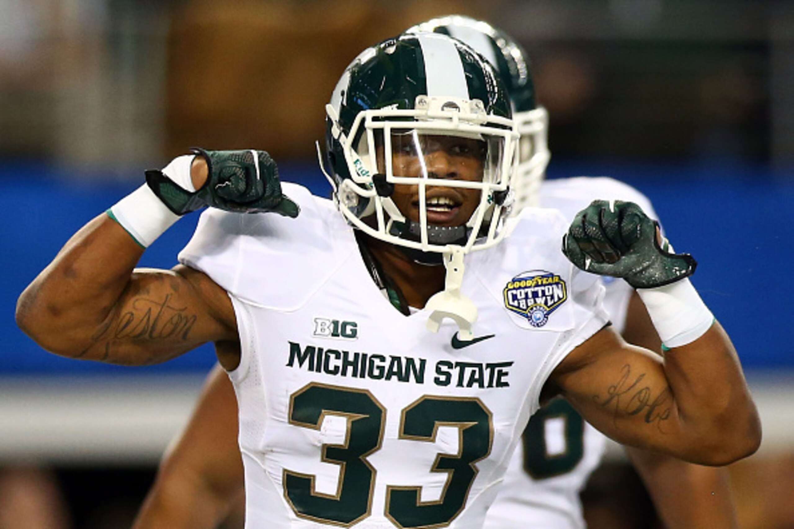 ARLINGTON, TX - JANUARY 01:  Jeremy Langford #33 of the Michigan State Spartans celebrates his touchdown against the Baylor Bears during the first half of the Goodyear Cotton Bowl Classic at AT&T Stadium on January 1, 2015 in Arlington, Texas.  (Photo by 