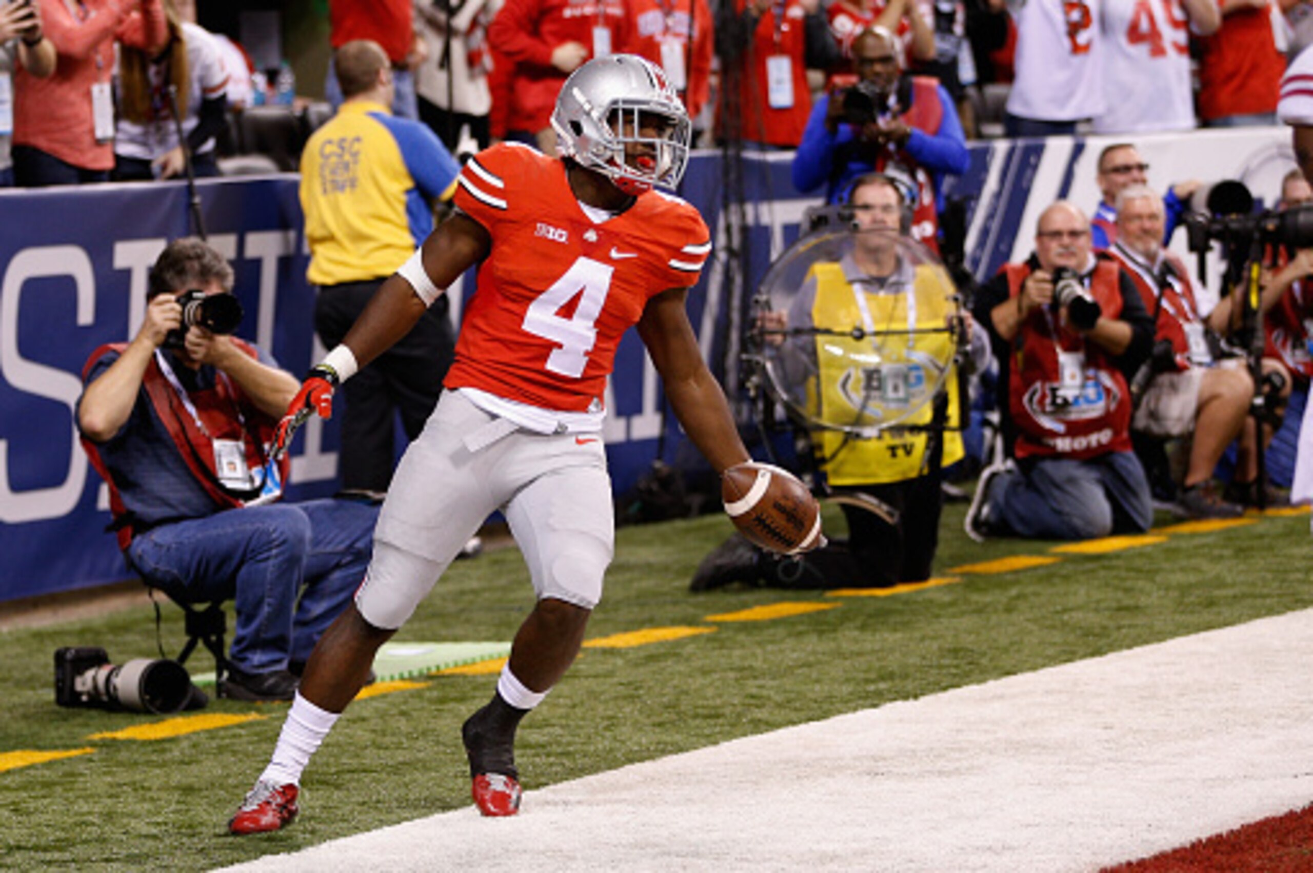 INDIANAPOLIS, IN - DECEMBER 06:  Curtis Samuel #4 of the Ohio State Buckeyes celebrates a touchdown in the fourth quarter against the Wisconsin Badgers in the Big Ten Championship at Lucas Oil Stadium on December 6, 2014 in Indianapolis, Indiana.  The Buc