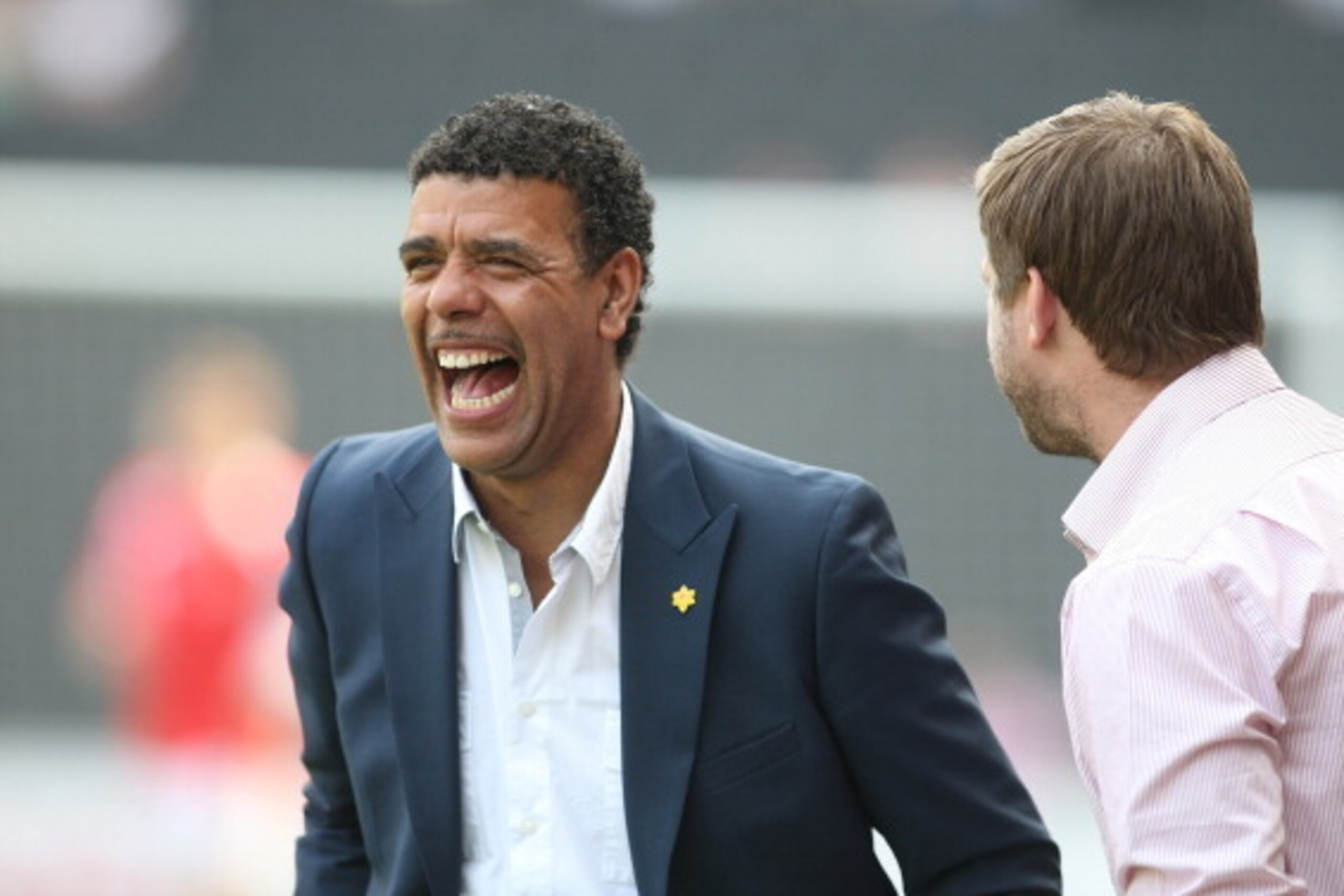 MILTON KEYNES, ENGLAND - APRIL 22: Sky TV pundit Chris Kamara talks to MK Dons manager Karl Robinson prior to the npower League One match between MK Dons and Huddersfield Town at Stadium mk on April 22, 2011 in Milton Keynes, England. (Photo by Pete Norto
