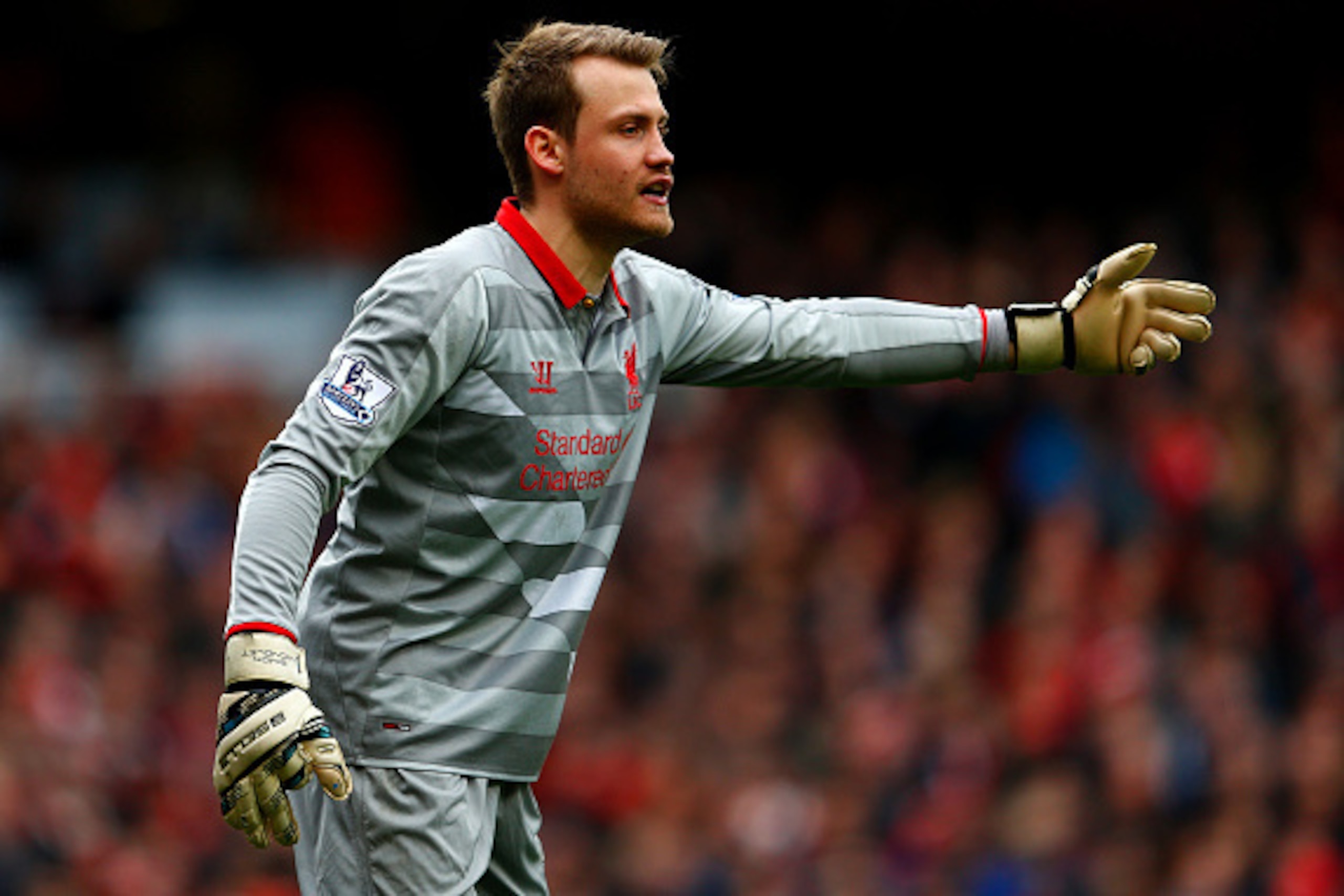 LONDON, ENGLAND - APRIL 04:  Simon Mignolet of Liverpool signals during the Barclays Premier League match between Arsenal and Liverpool at Emirates Stadium on April 4, 2015 in London, England.  (Photo by Julian Finney/Getty Images)