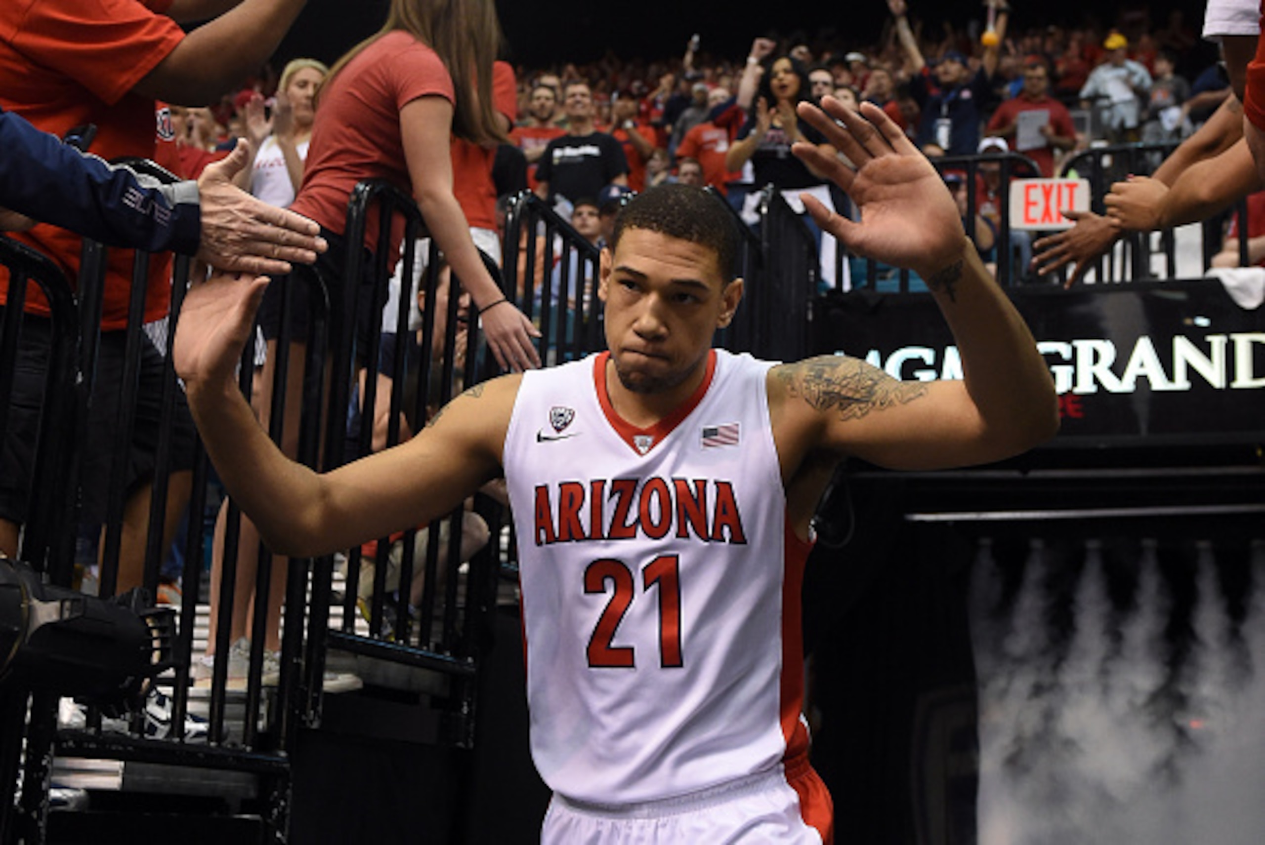 LAS VEGAS, NV - MARCH 13:  Brandon Ashley #21 of the Arizona Wildcats is introduced before a semifinal game of the Pac-12 Basketball Tournament against the UCLA Bruins at the MGM Grand Garden Arena on March 13, 2015 in Las Vegas, Nevada. Arizona won 70-64