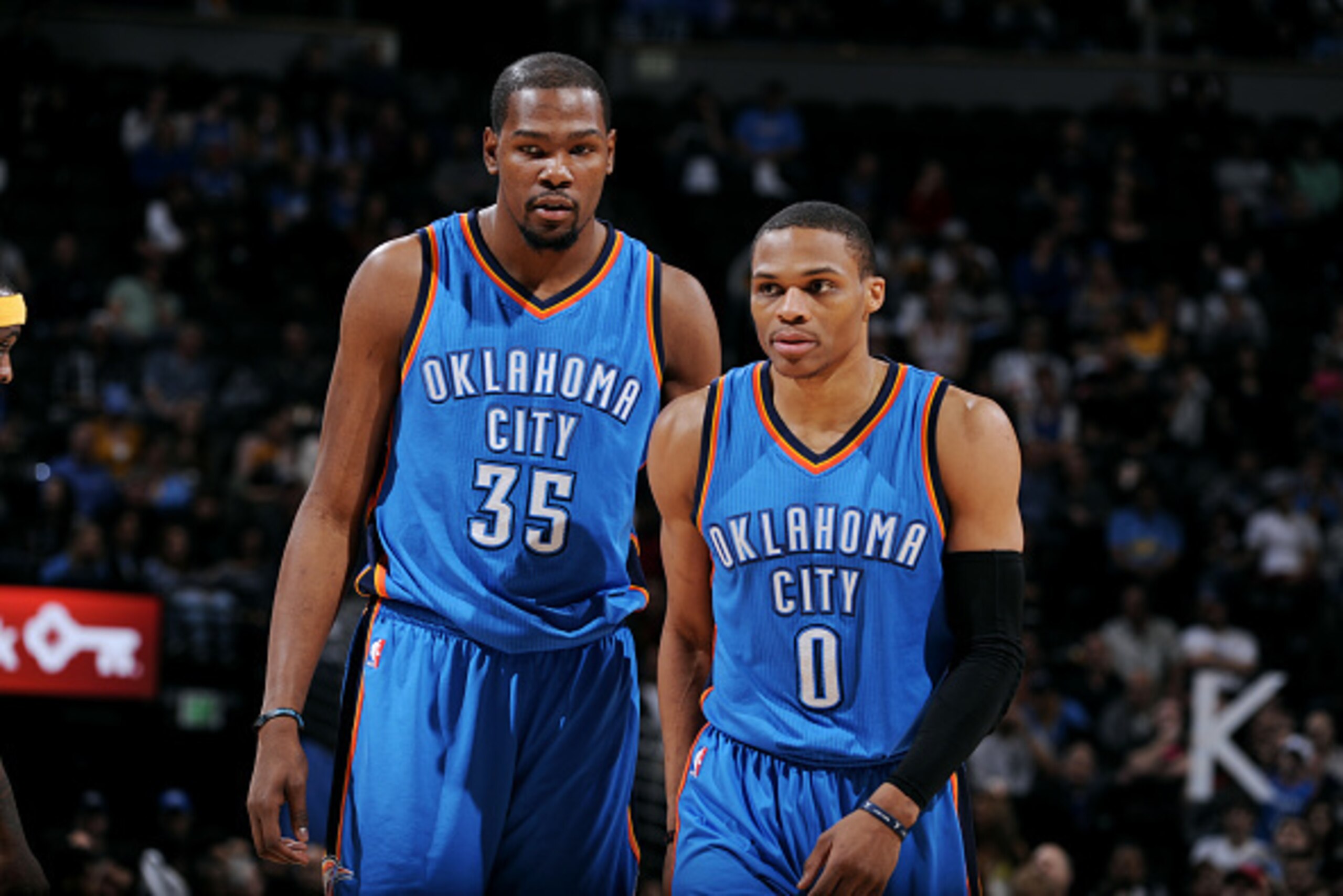DENVER, CO - FEBRUARY 9: Kevin Durant #35 and Russell Westbrook #0 of the Oklahoma City Thunder stand on the court during a game against the Denver Nuggets on February 9, 2015 at Pepsi Center in Denver, Colorado. NOTE TO USER: User expressly acknowledges 