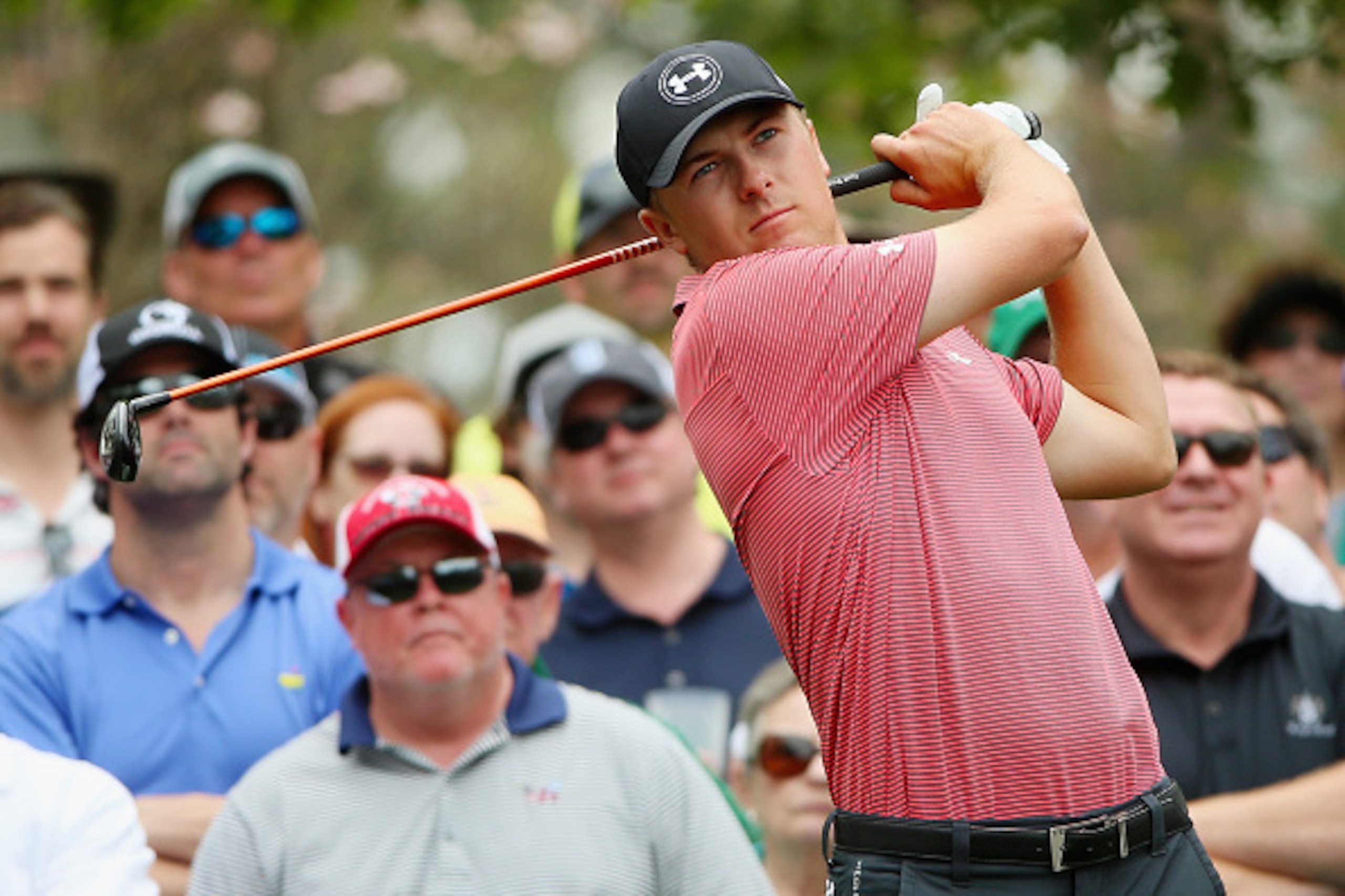 AUGUSTA, GA - APRIL 06:  Jordan Spieth of the United States hits a shot as a gallery of fans look on during a practice round prior to the start of the 2015 Masters Tournament at Augusta National Golf Club on April 6, 2015 in Augusta, Georgia.  (Photo by A