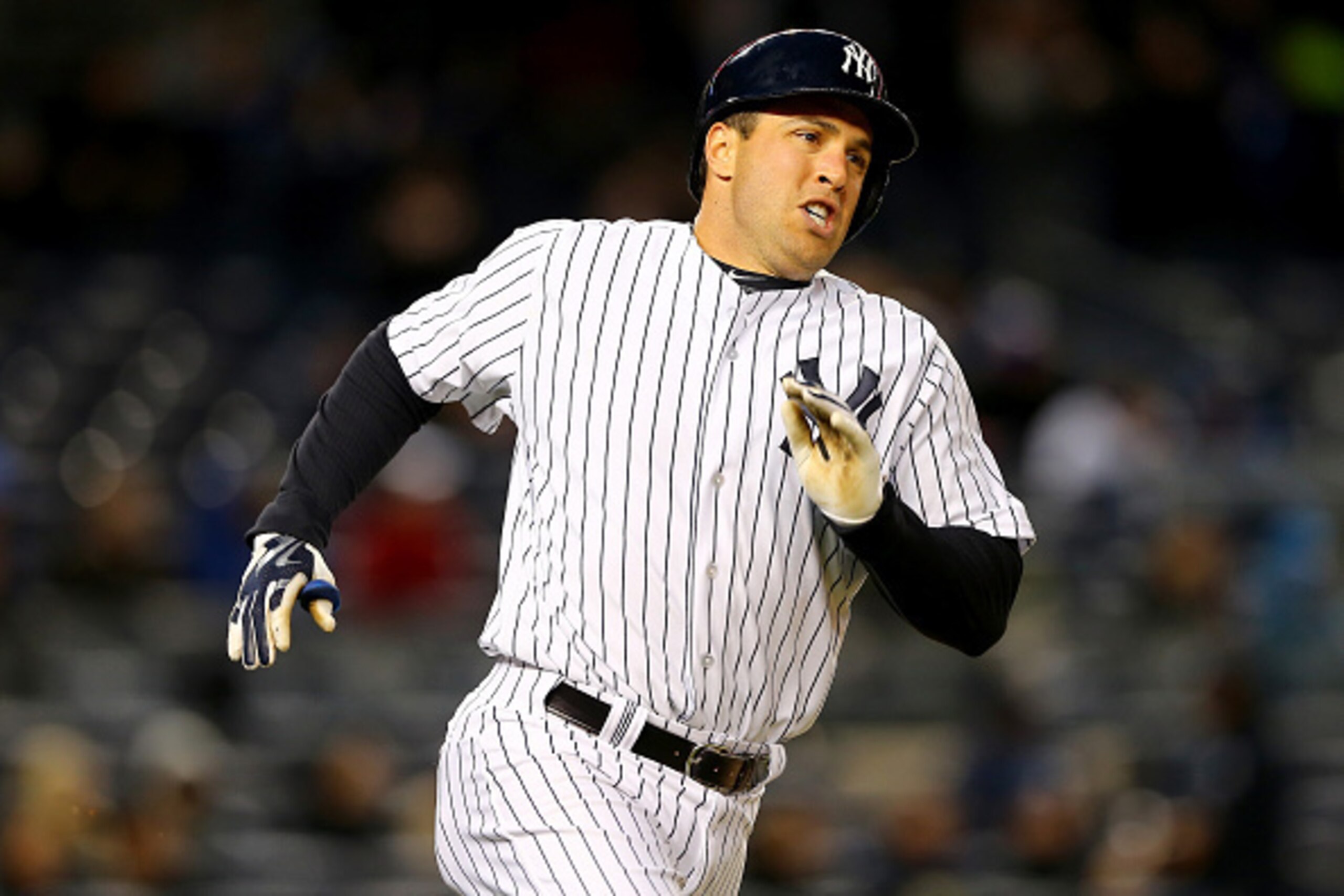 NEW YORK, NY - APRIL 08:  Mark Teixeira #25 of the New York Yankees rounds first base after he hit a double in the second inning against the Toronto Blue Jays on April 8, 2015 at Yankee Stadium in the Bronx borough of New York City.  (Photo by Elsa/Getty 