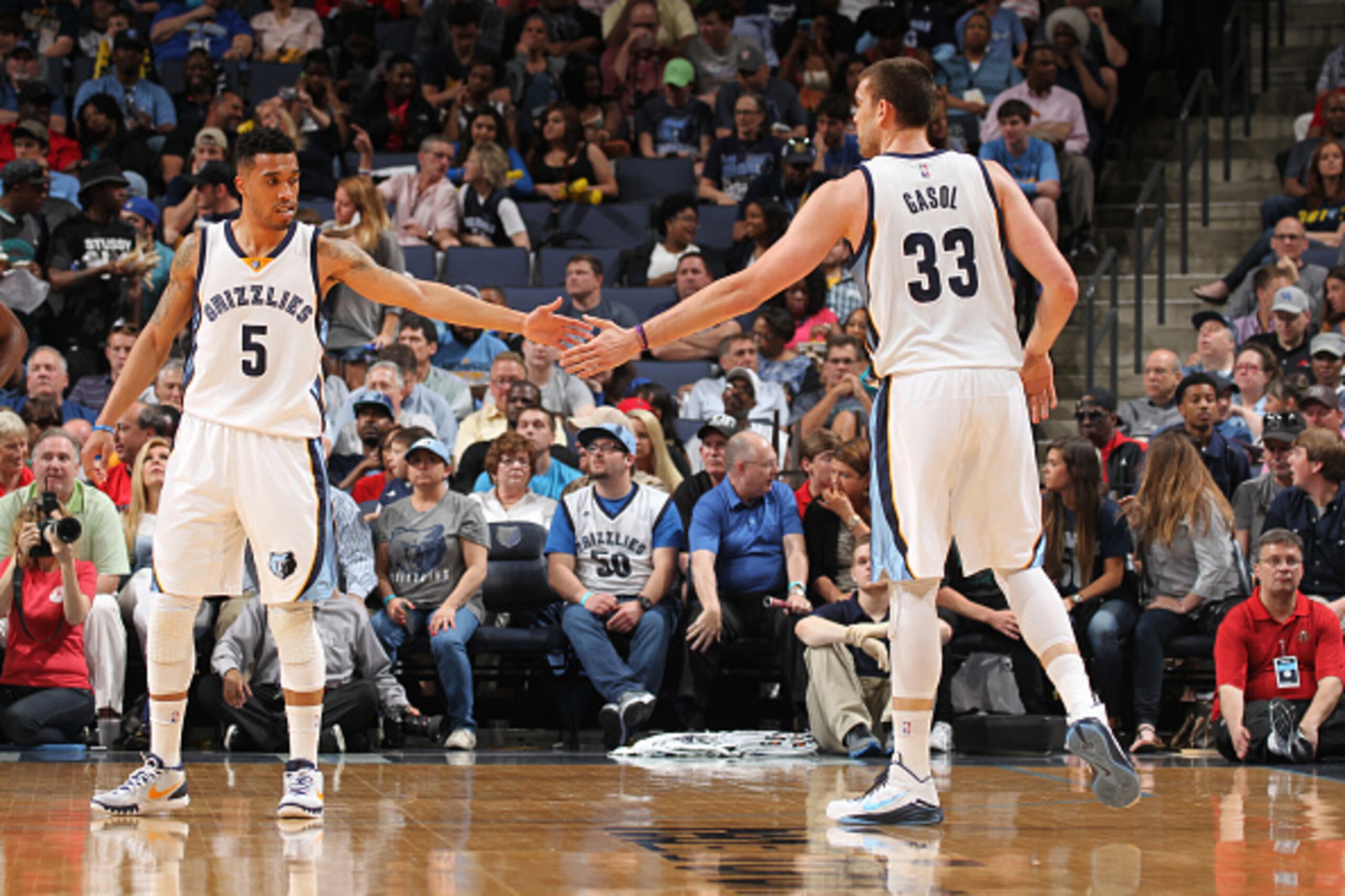 MEMPHIS, TN - APRIL 8: Courtney Lee #5 high fives Marc Gasol #33 of the Memphis Grizzlies during the game on April 8, 2015 at FedExForum in Memphis, Tennessee. NOTE TO USER: User expressly acknowledges and agrees that, by downloading and/or using this pho