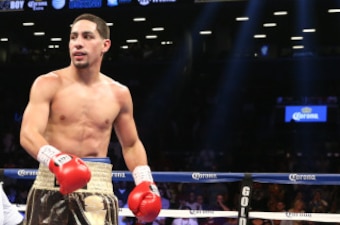 BROOKLYN, NY - AUGUST 9: Danny Garcia (Brown/Gold trunks) knocks down Rod Salka (Black/Gold trunks) during their fight at the Barclays Center on August 9, 2014 in Brooklyn, New York. (Photo by Ed Mulholland/Getty Images)