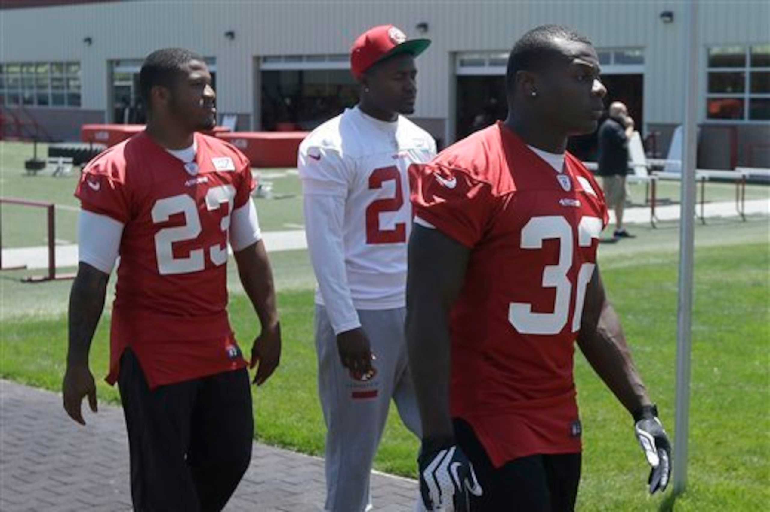 One gone, one remains—LaMichael James (No. 23) asked for his release before last season while Kendall Hunter (No. 32) will serve as the 49ers' No. 3 back in 2015.