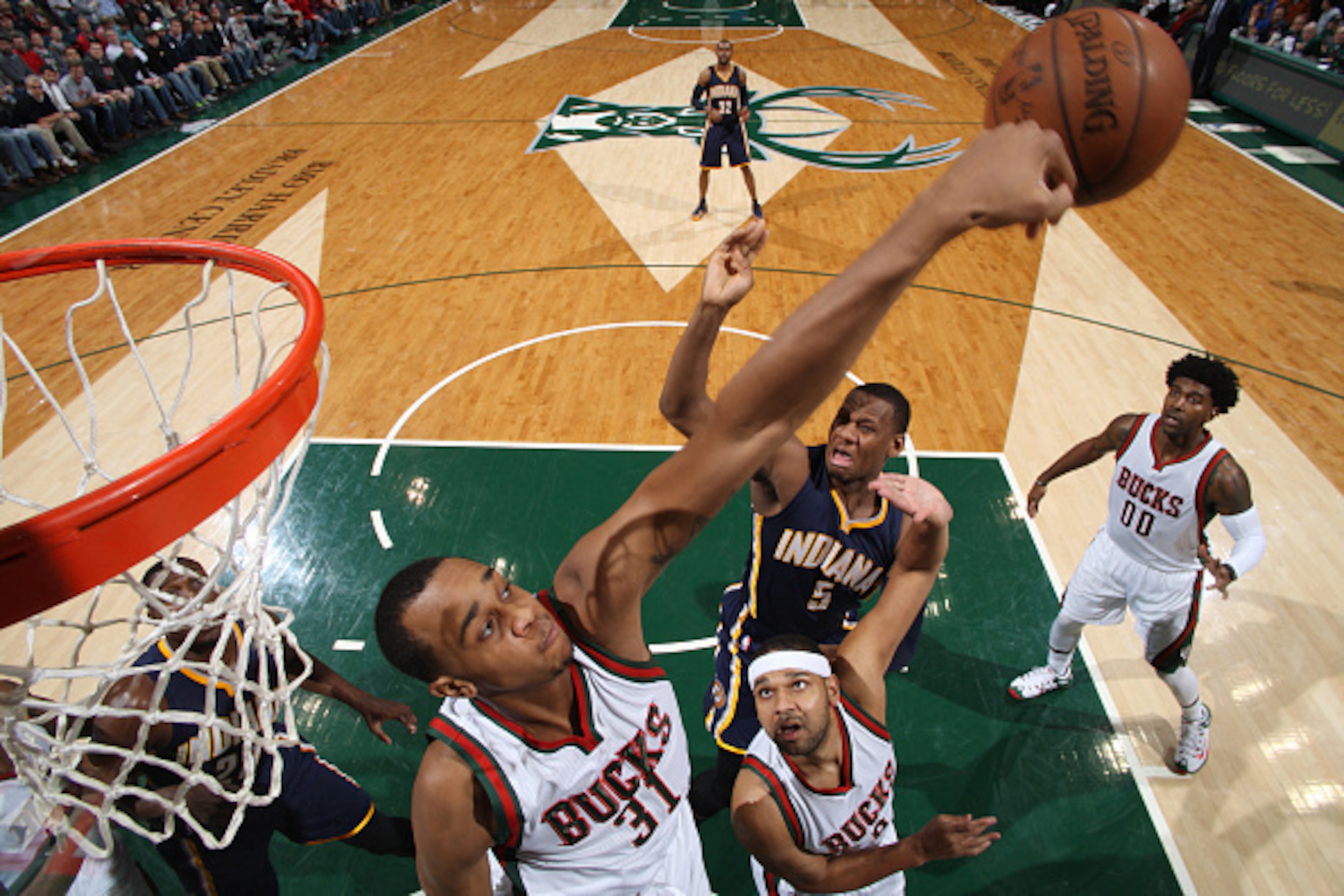 MILWAUKEE, WI - MARCH 26: John Henson #31 of the Milwaukee Bucks blocks a shot against Lavoy Allen #5 of the Indiana Pacers on March 26, 2015 at BMO Harris Bradley Center in Milwaukee, Wisconsin. NOTE TO USER: User expressly acknowledges and agrees that, 