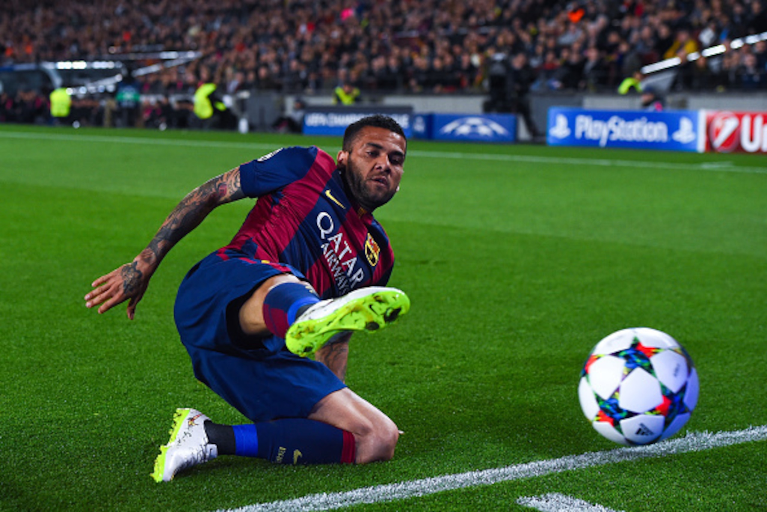 BARCELONA, SPAIN - MARCH 18:  Dani Alves of FC Barcelona dives for the ball during the UEFA Champions League round of 16 second leg match between FC Barcelona and Manchester City at the Camp Nou stadium on March 18, 2015 in Barcelona, Spain.  (Photo by Da
