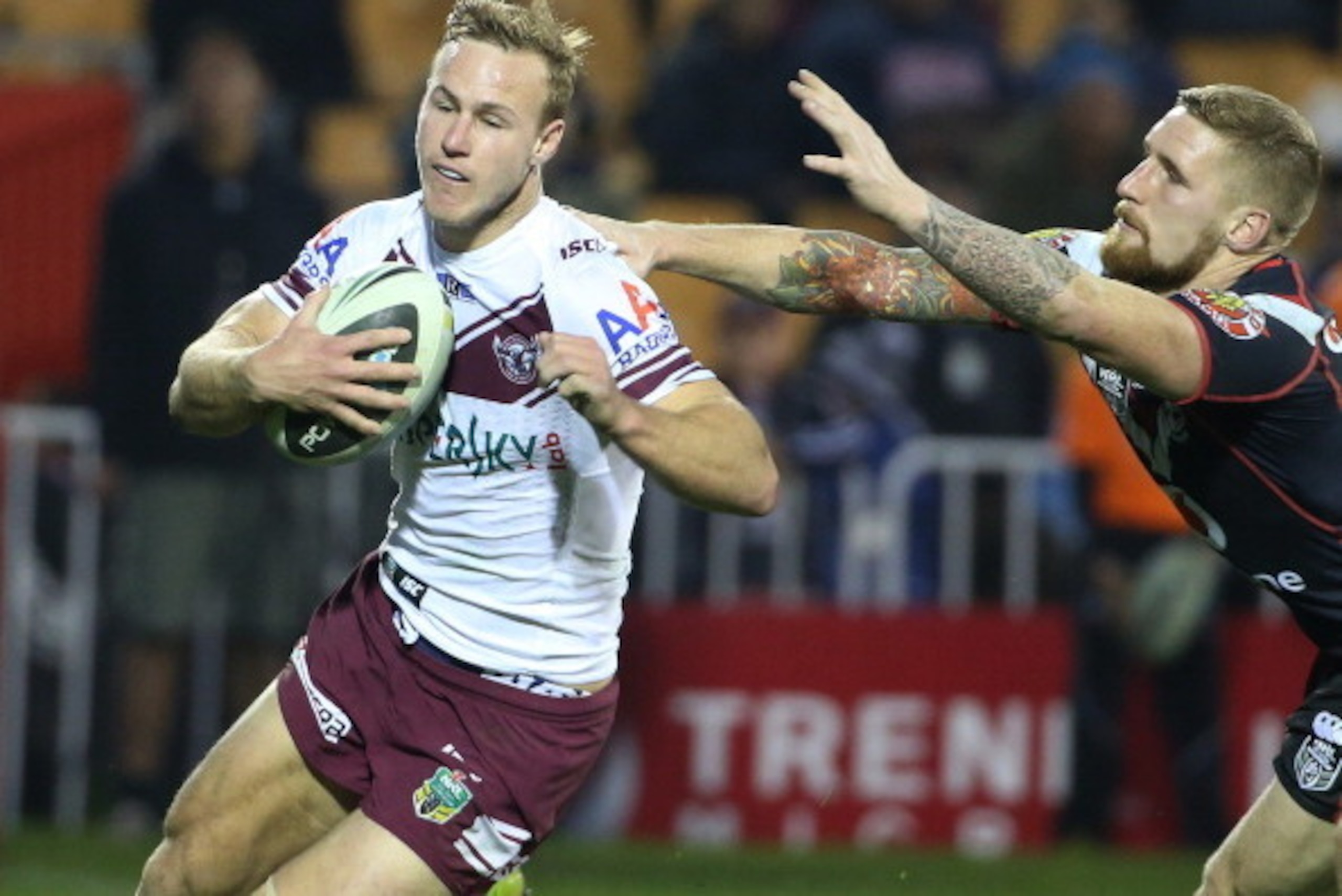 AUCKLAND, NEW ZEALAND - JULY 27:  Daly Cherry-Evans runs in to score for Manly tackled by Sam Tomkins of the Warriors during the round 20 NRL match between the New Zealand Warriors and the Manly Sea Eagles at Mt Smart Stadium on July 27, 2014 in Auckland,