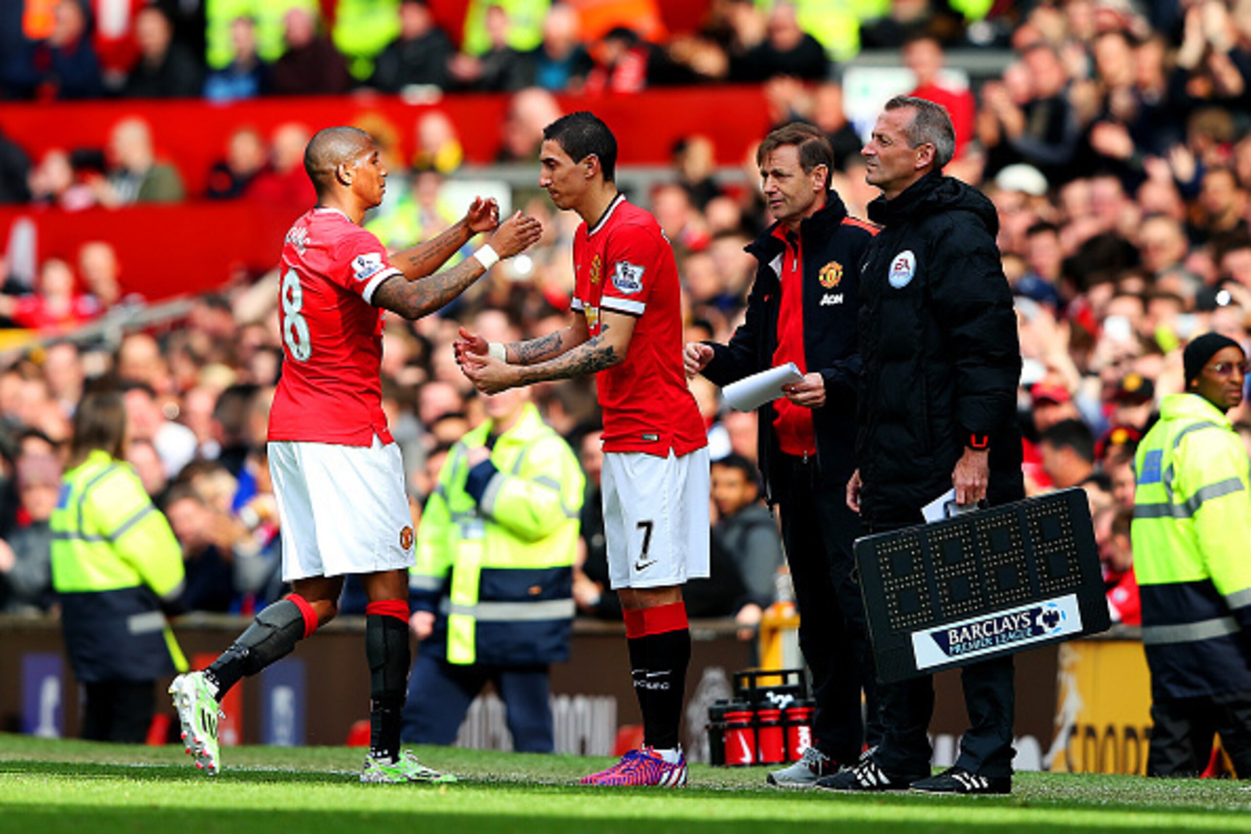 MANCHESTER, ENGLAND - APRIL 04:  Ashley Young of Manchester United is replaced by Angel di Maria of Manchester United during the Barclays Premier League match between Manchester United and Aston Villa at Old Trafford on April 4, 2015 in Manchester, Englan