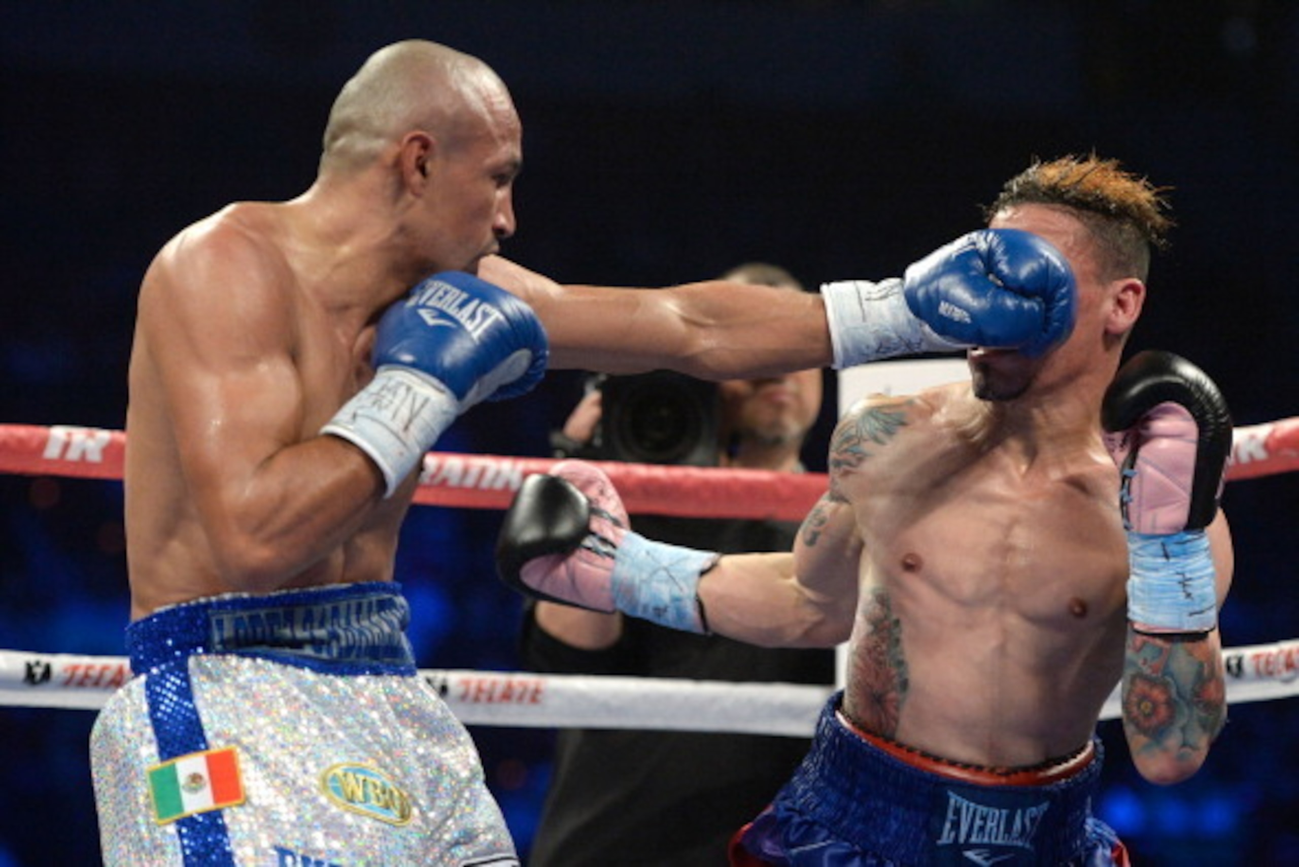 LAS VEGAS, NV - OCTOBER 12:  Orlando Salido (L) lands a left to the face of Orlando Cruz during their WBO featherweight championship bout at the Thomas & Mack Center on October 12, 2013 in Las Vegas, Nevada.  (Photo by Jeff Bottari/Getty Images)