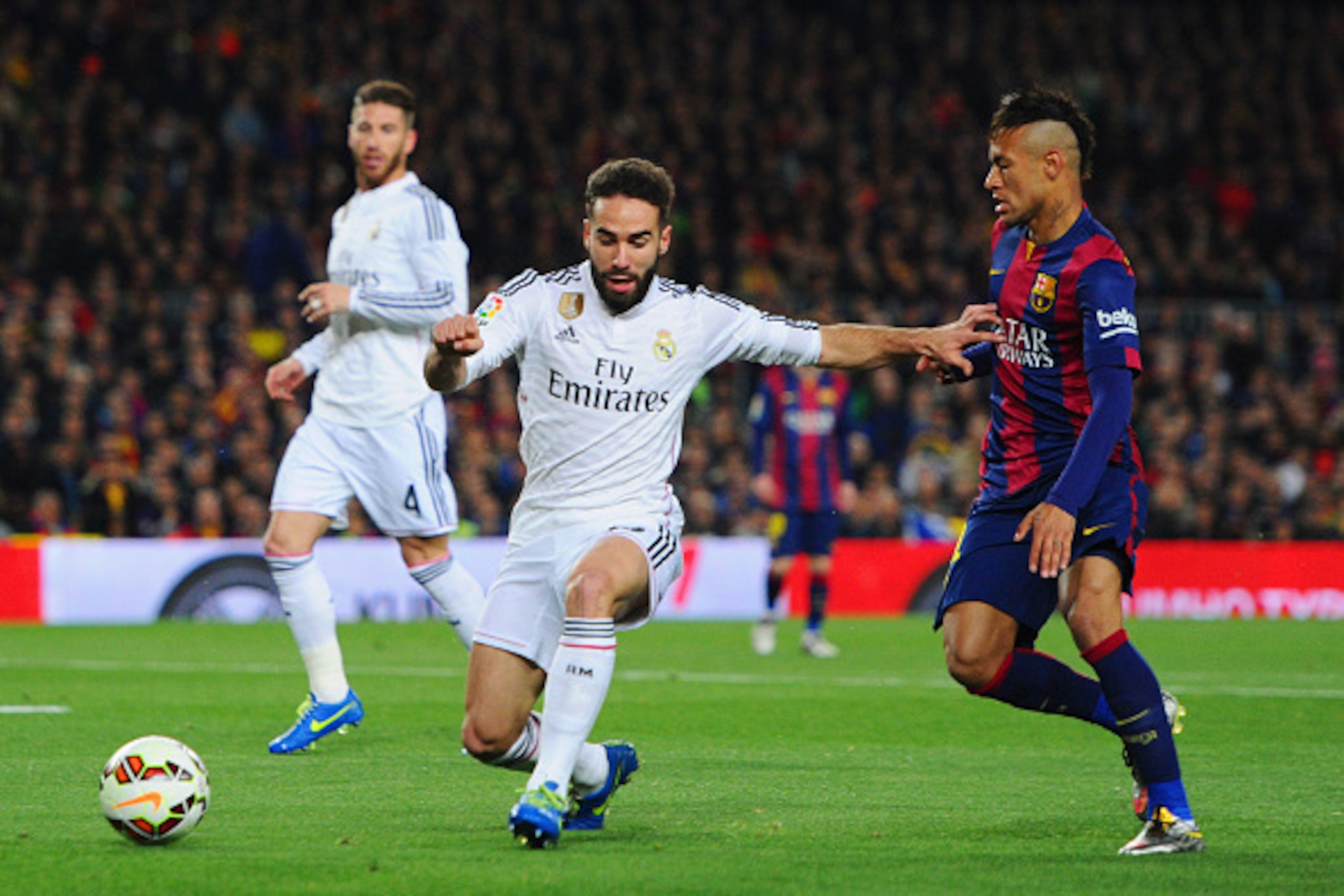 BARCELONA, SPAIN - MARCH 22: Daniel Carvajal of Real Madrid CF holds off Neymar of Barcelona during the La Liga match between FC Barcelona and Real Madrid CF at Camp Nou on March 22, 2015 in Barcelona, Spain. (Photo by Alex Caparros/Getty Images) BARCELONA, SPAIN - MARCH 22: Daniel Carvajal of Real Madrid CF holds off Neymar of Barcelona during the La Liga match between FC Barcelona and Real Madrid CF at Camp Nou on March 22, 2015 in Barcelona, Spain. (Photo by Alex Caparros/Getty Images)