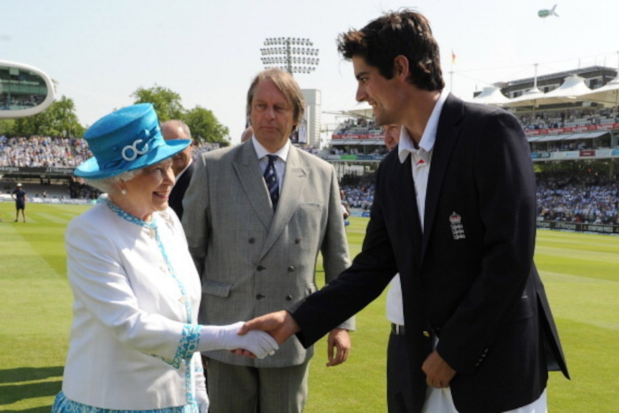 LONDON, UNITED KINGDOM - JULY 18:  Queen Elizabeth II shakes hands with England captain Alastair Cook, watched by ECB Chairman Giles Clarke (centre), ahead of the first day of the second test between England and Australia at Lord's Cricket Ground on July 