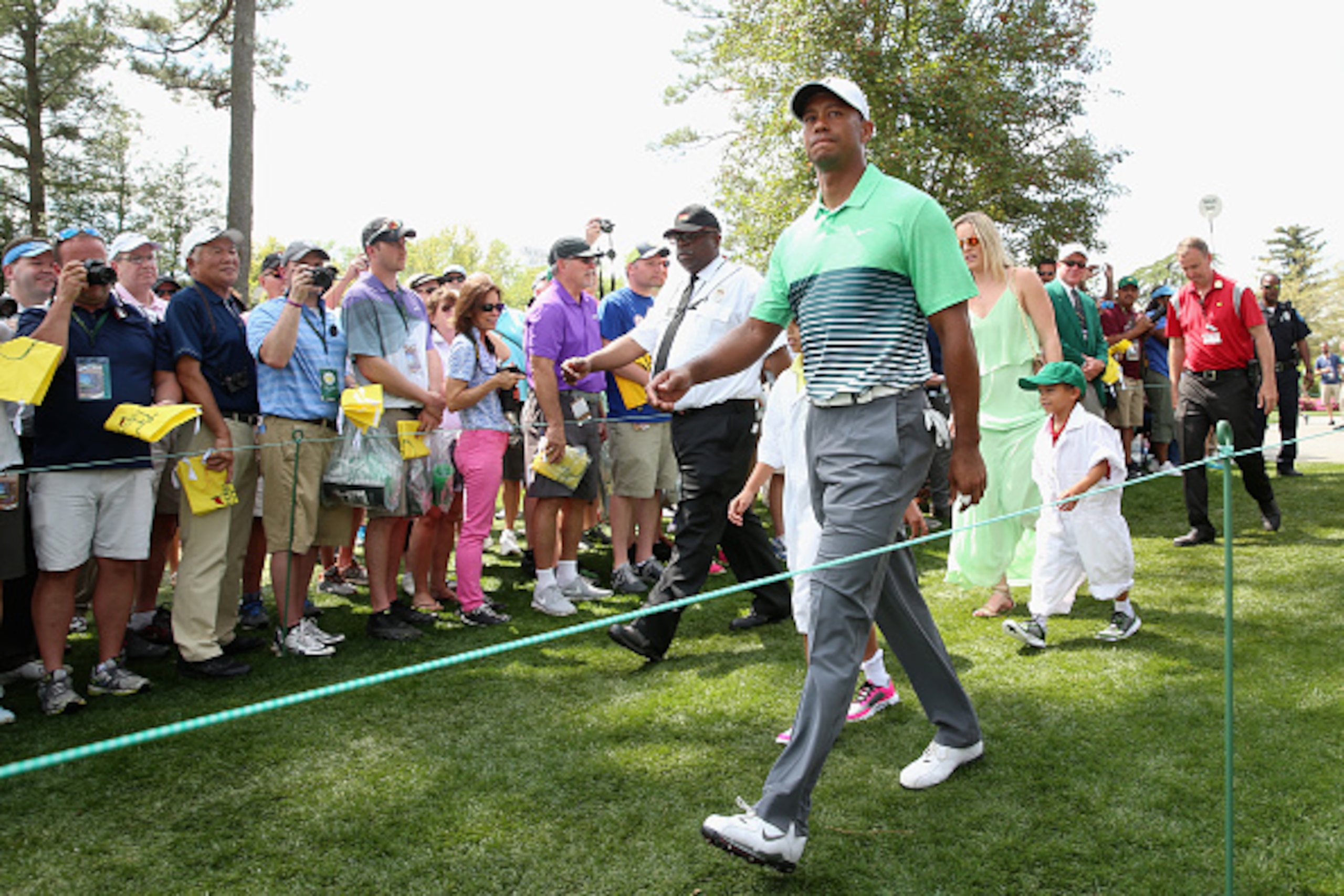 AUGUSTA, GA - APRIL 08:  Tiger Woods of the United States walks alongside his girlfriend Lindsey Vonn, son Charlie and daughter Sam during the Par 3 Contest prior to the start of the 2015 Masters Tournament at Augusta National Golf Club on April 8, 2015 i