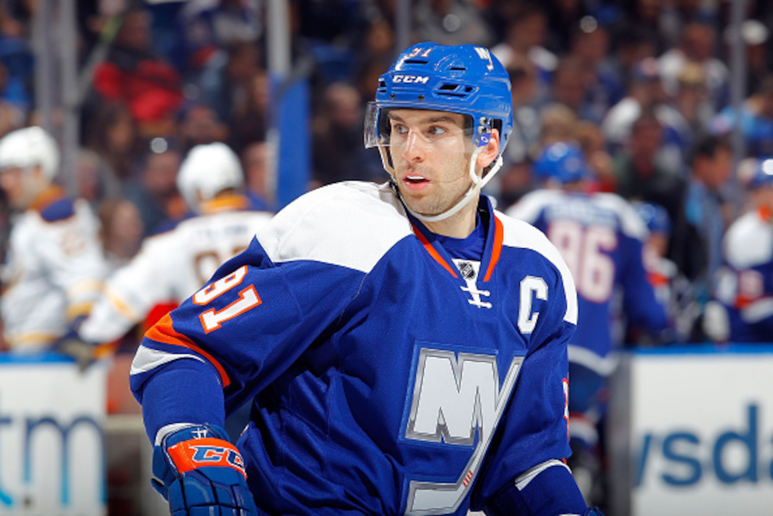 UNIONDALE, NY - APRIL 04:  John Tavares #91 of the New York Islanders in action against the Buffalo Sabres on April 4, 2015 at Nassau Veterans Memorial Coliseum in Uniondale, New York. The Islanders defeated the Sabres 3-0.  (Photo by Jim McIsaac/NHLI via