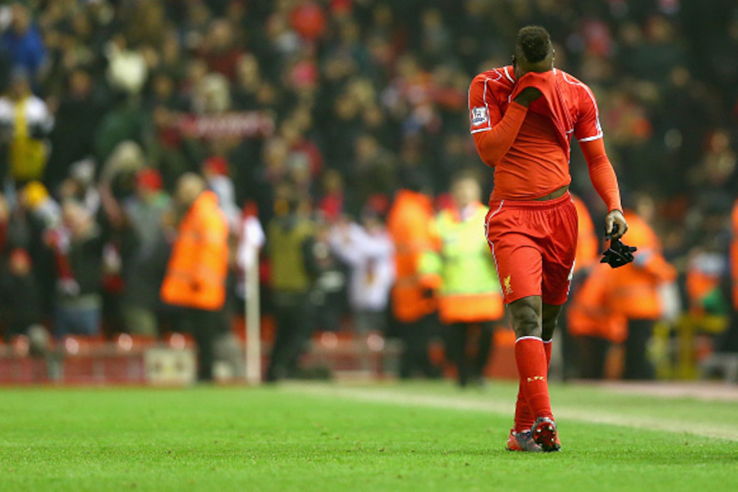 LIVERPOOL, ENGLAND - FEBRUARY 10:  Mario Balotelli of Liverpool walks off the pitch after scoring his second half winning goal during the Barclays Premier League match between Liverpool and Tottenham Hotspur at Anfield on February 10, 2015 in Liverpool, E