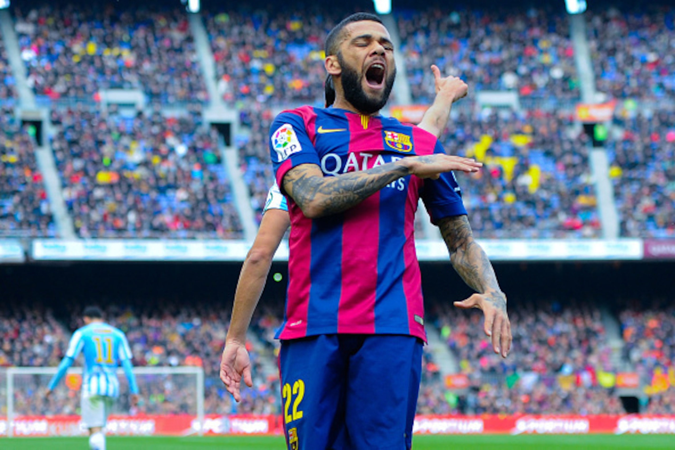 BARCELONA, SPAIN - FEBRUARY 21:  Dani Alves of FC Barcelona reacts during the La Liga match between FC Barcelona and Malaga CF at Camp Nou on February 21, 2015 in Barcelona, Spain.  (Photo by David Ramos/Getty Images)