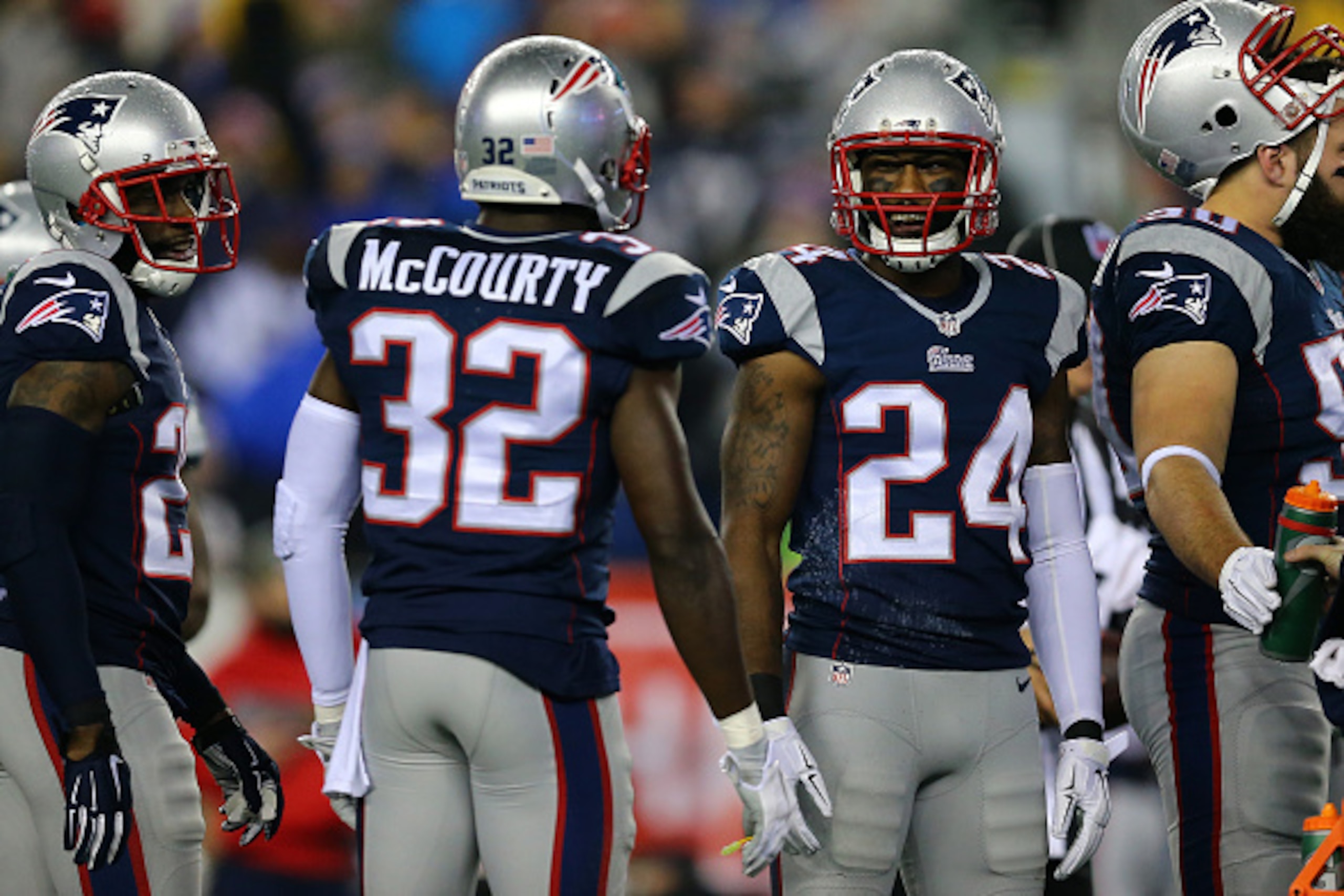 FOXBORO, MA - JANUARY 18:  Darrelle Revis #24 and  Devin McCourty #32 of the New England Patriots talk after a play in the first half against the Indianapolis Colts of the 2015 AFC Championship Game at Gillette Stadium on January 18, 2015 in Foxboro, Mass