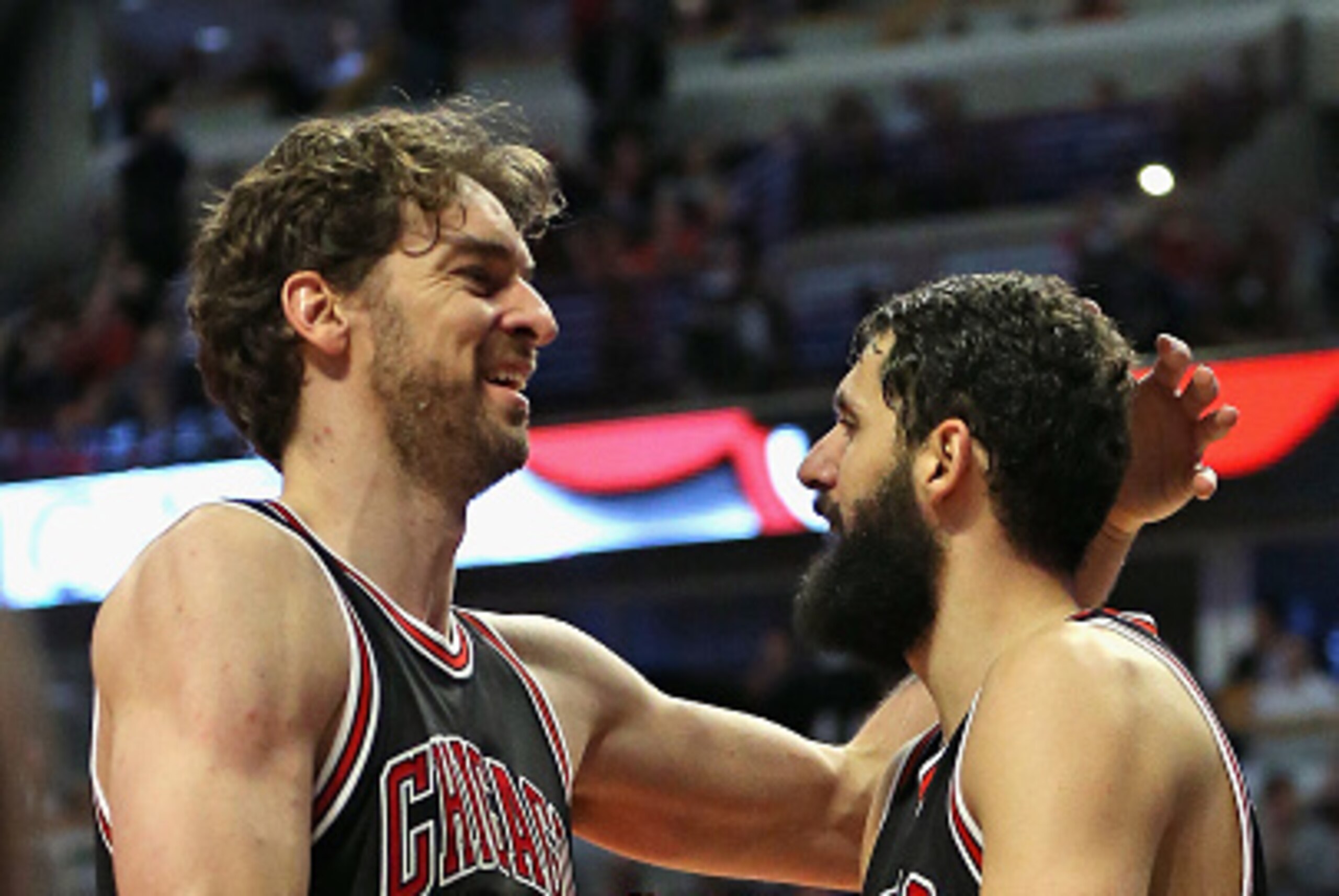CHICAGO, IL - MARCH 23: Pau Gasol #16 of the Chicago Bulls (L) congratulates Nikola Mirotic #44 after he made an off-balance shot against the Charlotte Hornets at the United Center on March 23, 2015 in Chicago, Illinois. The Bulls defeated the Hornets 98-