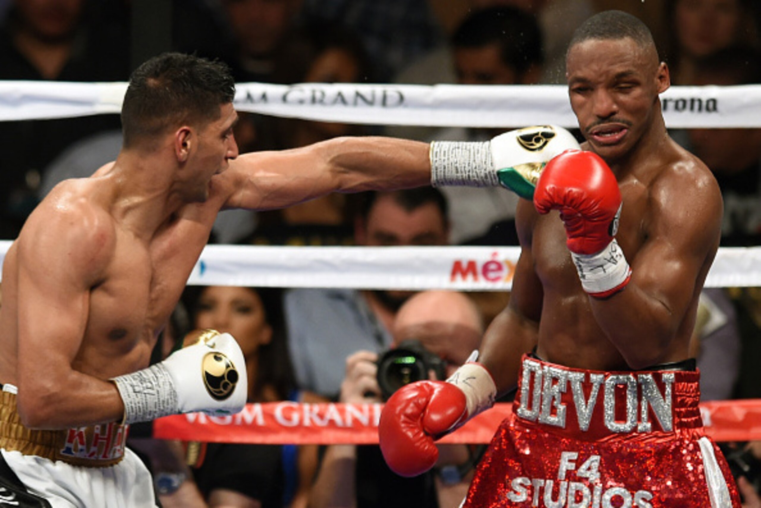 LAS VEGAS, NV - DECEMBER 13:  Amir Khan (L) throws a left at Devon Alexander in the eighth round of their welterweight bout at the MGM Grand Garden Arena on December 13, 2014 in Las Vegas, Nevada. Khan won by unanimous decision.  (Photo by Ethan Miller/Ge