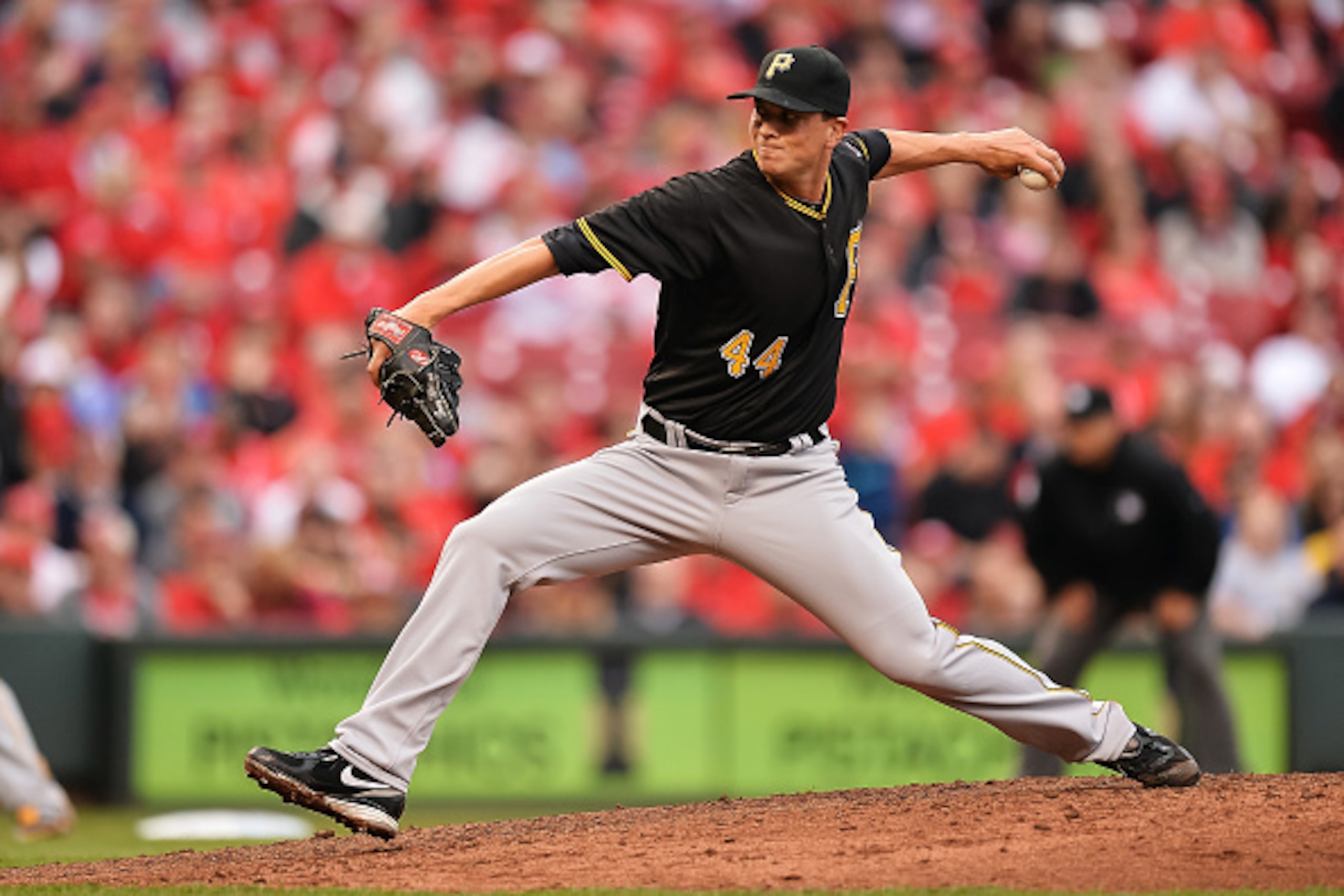 CINCINNATI, OH - APRIL 6:  Tony Watson #44 of the Pittsburgh Pirates pitches against the Cincinnati Reds at Great American Ball Park on April 6, 2015 in Cincinnati, Ohio.  (Photo by Jamie Sabau/Getty Images)