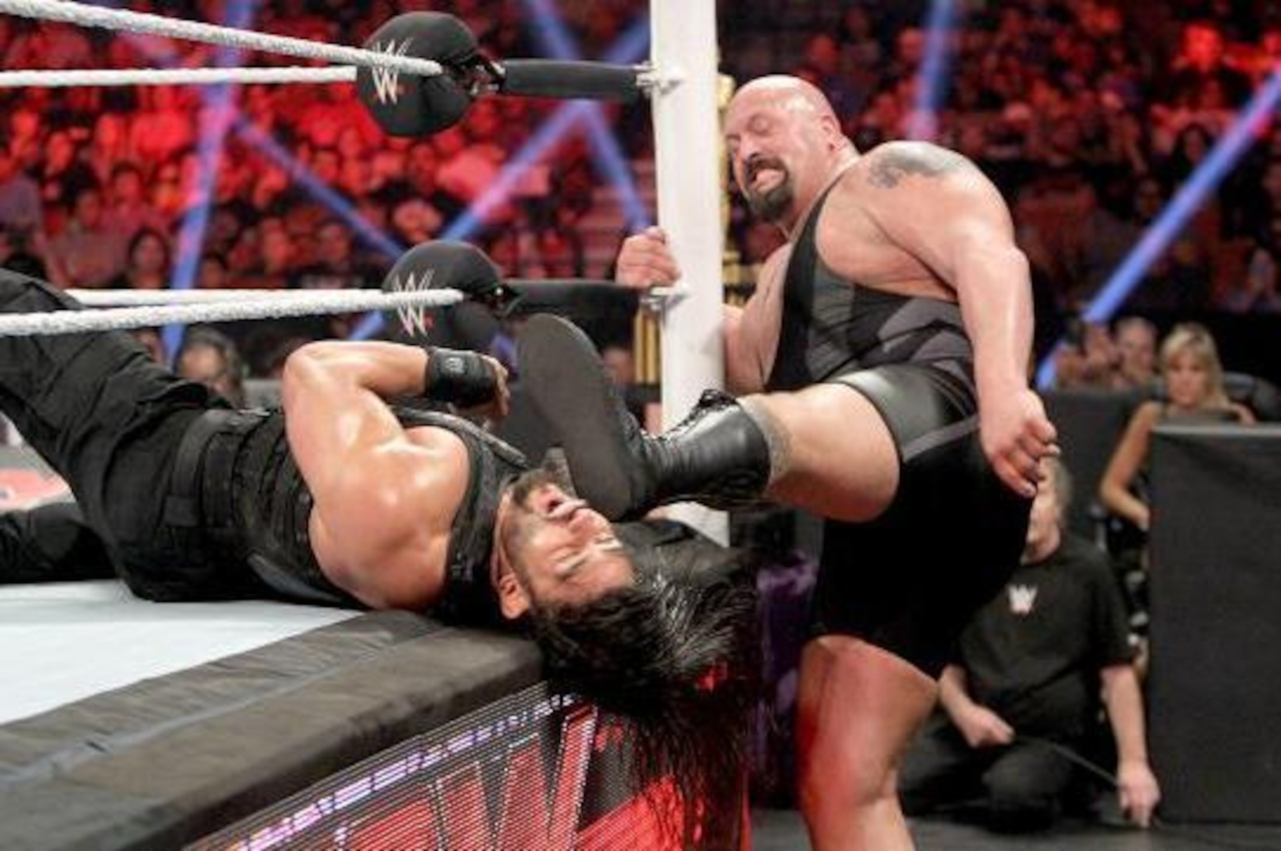 Big Show kicks Roman Reigns. Big Show kicks Roman Reigns.